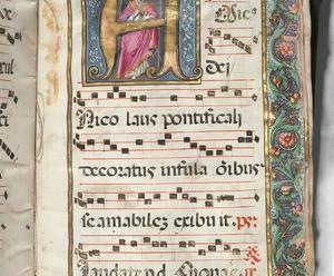 A colorful page from a centuries old choir book.