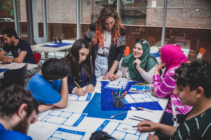 Neighborhood Salon Luminary Feda Eid works with visitors in the Bertucci Education Studio. Photo by Steve Osemwenkhae.