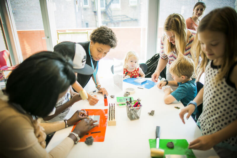 Visitors doing hands-on art activities in the Bertucci Education Studio. Photo by Matt Teuten.