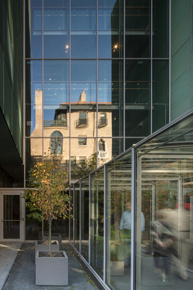 The history palace reflected in the glass exterior of the Renzo Piano-designed New Wing of the Isabella Stewart Gardner Museum
