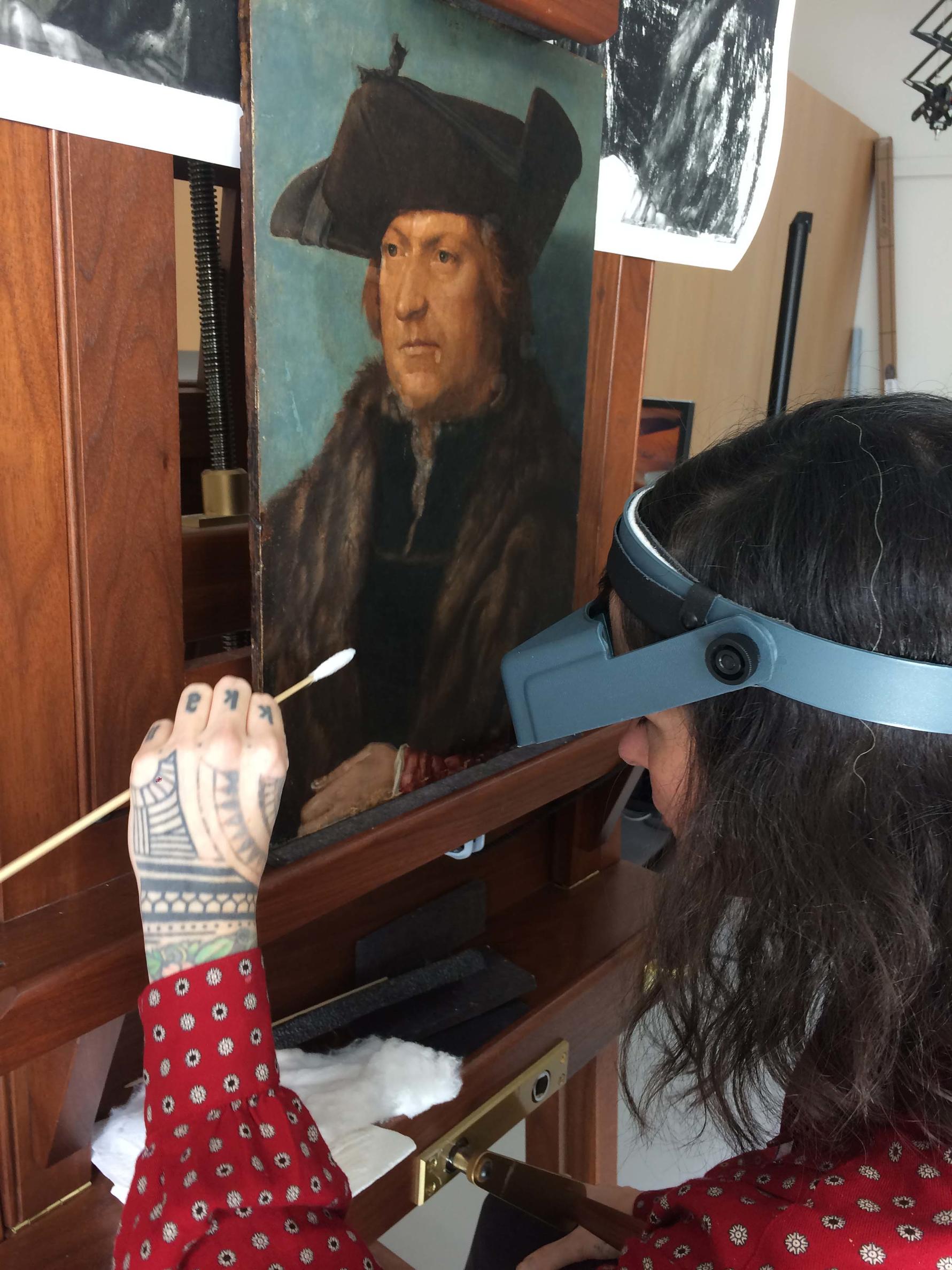 Conservation Intern Jennifer Myers working on Albrecht Durer's Man in a Fur Coat, 2019