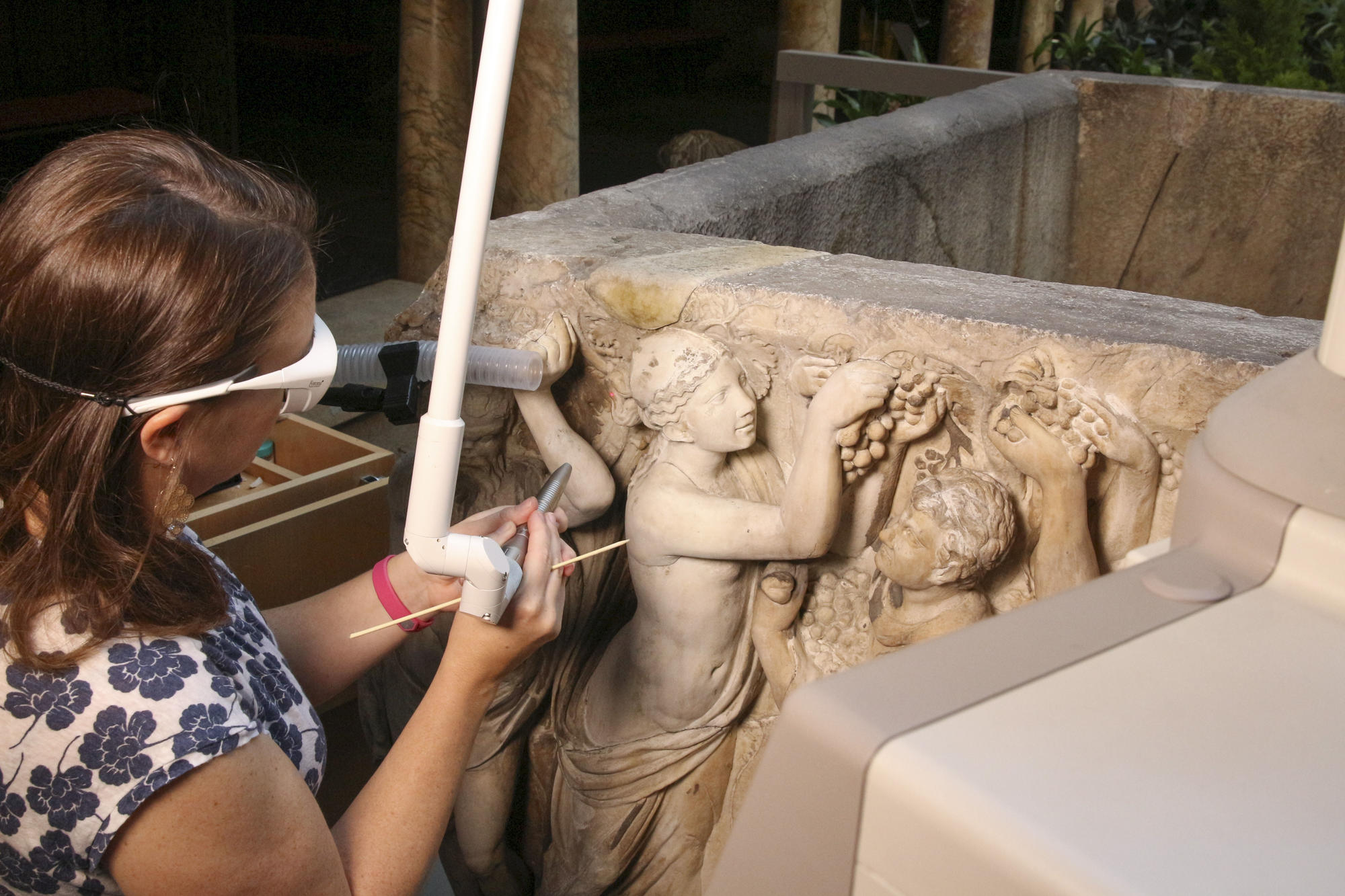 John L. and Susan K. Gardner Director of Conservation Holly Salmon using an Er:YAG laser to clean the Farnese Sarcophagus.