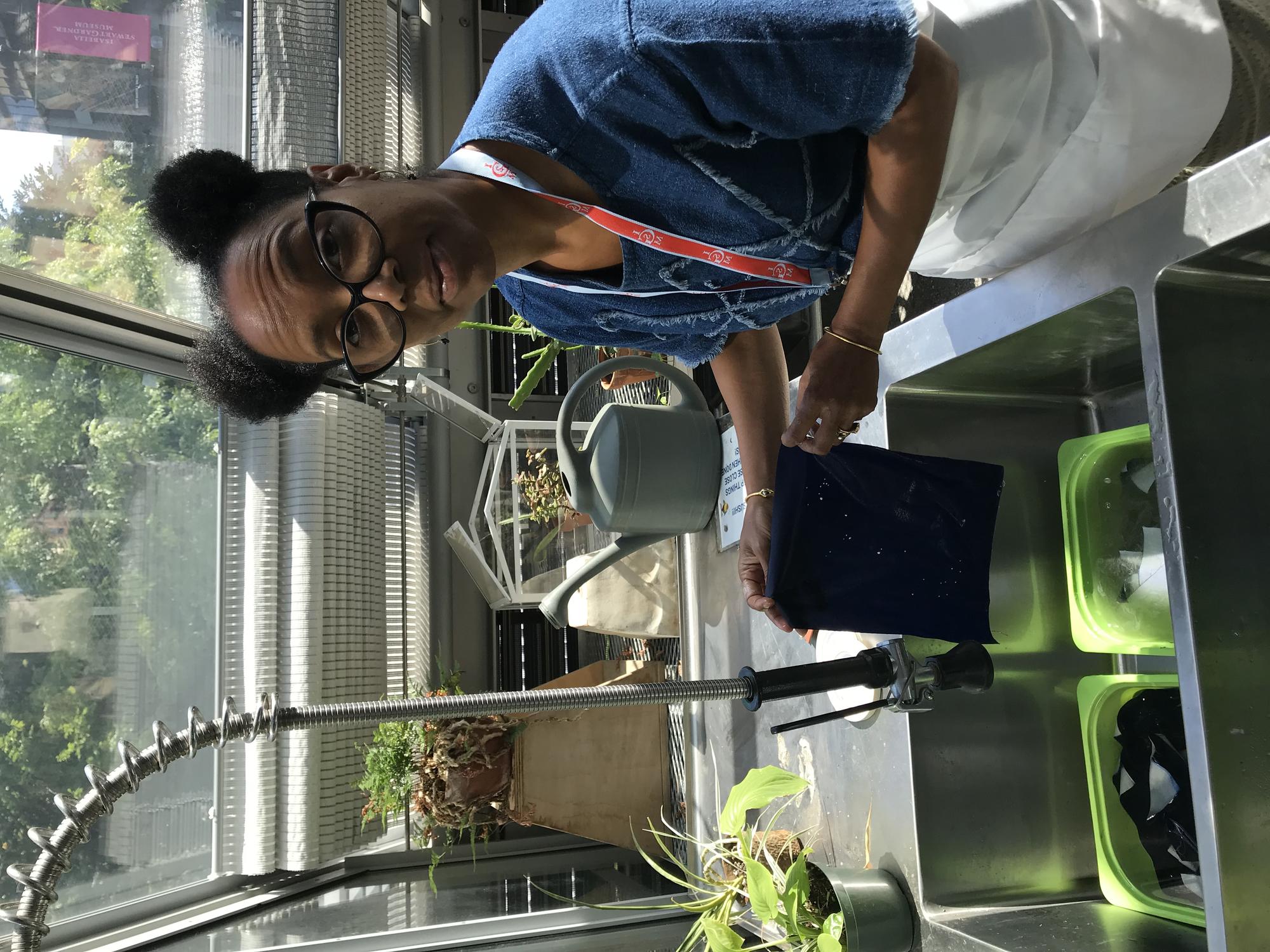 Sonya Clark working on cyanotype project in the Education Greenhouse, 2019