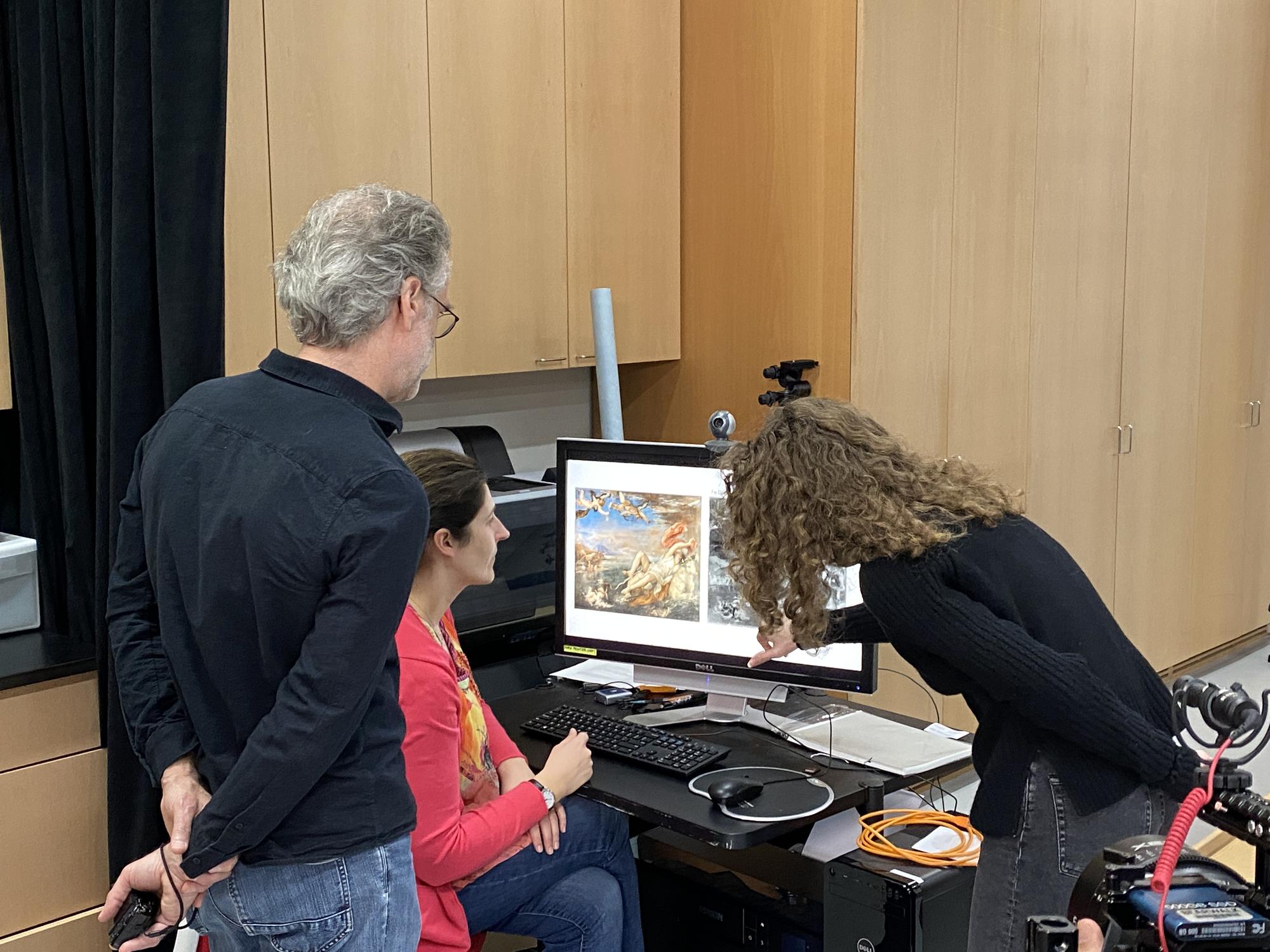 Mary Reid Kelley and Patrick Kelley look at the scans of Europa with conservator Jess Chloris, 2019 