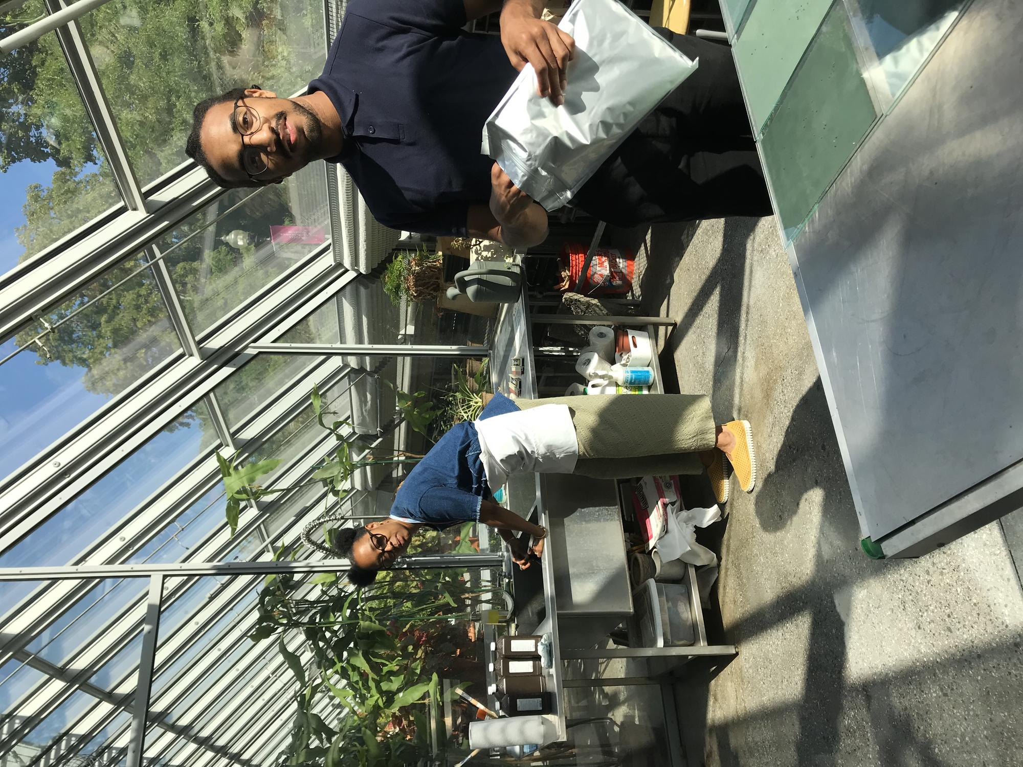 Sony Clark working on cyanotype project in the Education Greenhouse with Jonathan Jackson, 2019