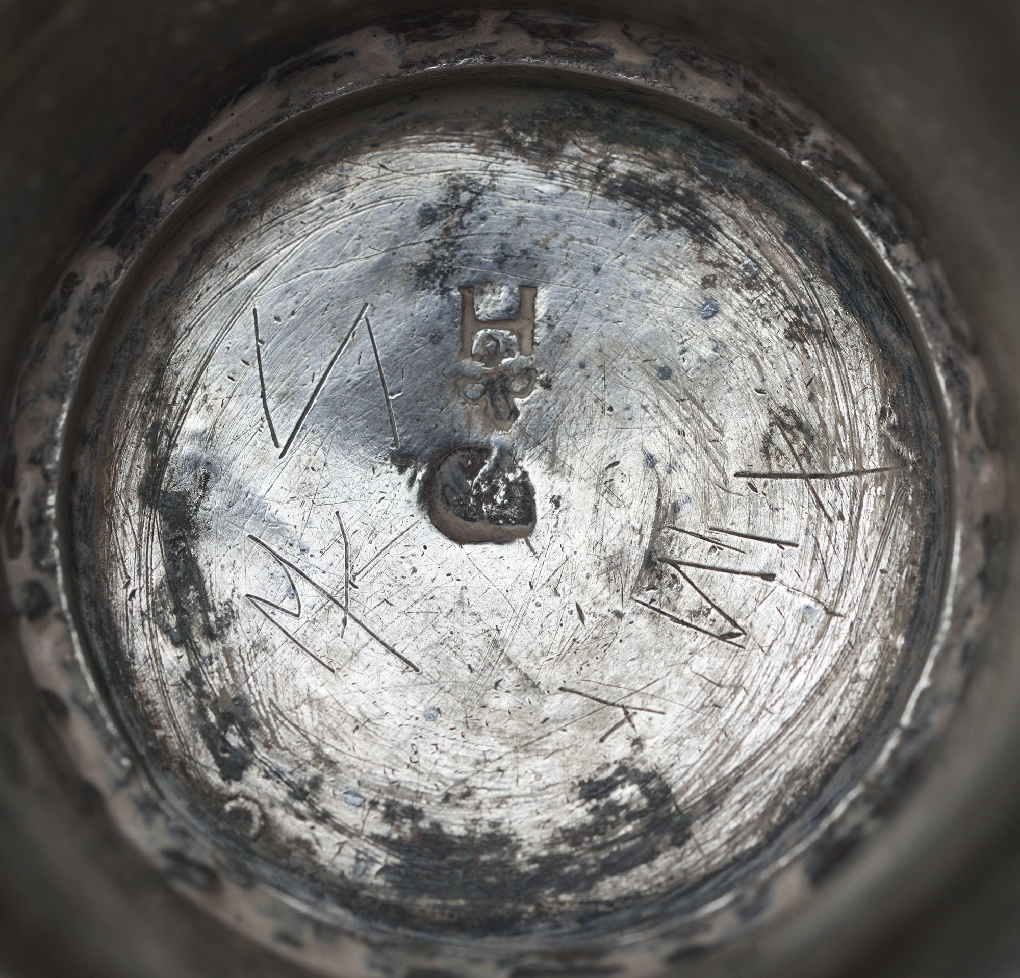 Detail of the bottom of a 18th century, Norwegian, Vase, showing hallmarks and maker’s mark