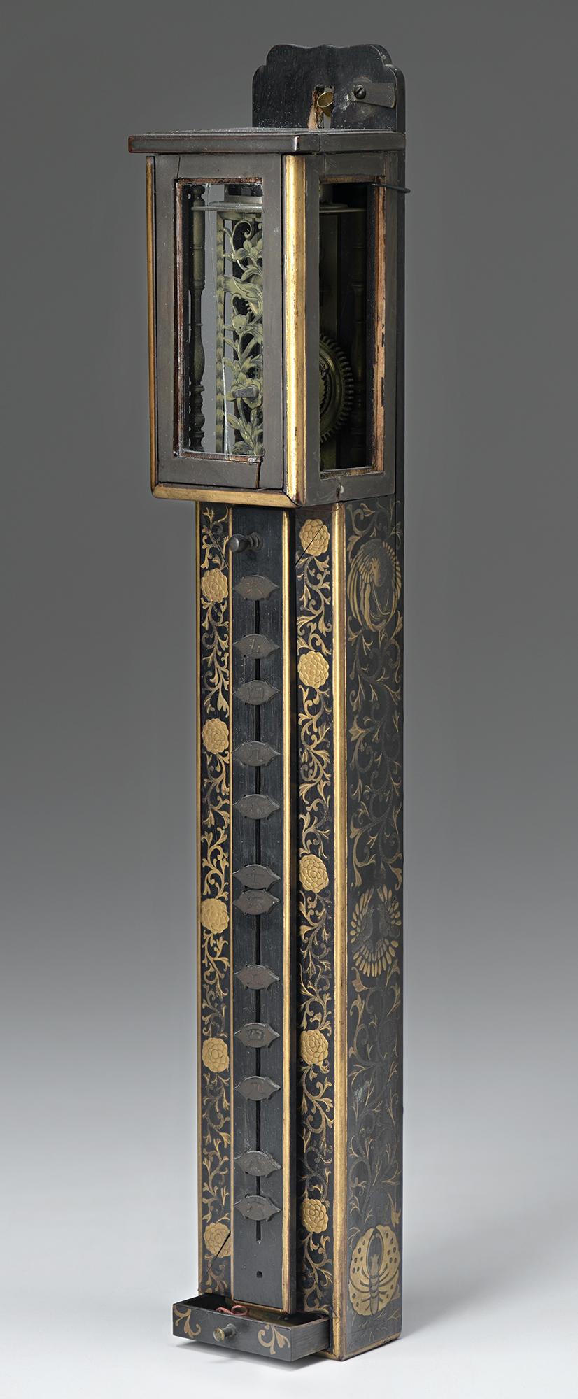 Japanese, Wall Clock, 18th century. Lacquered wood, with gold decoration and copper alloy fittings