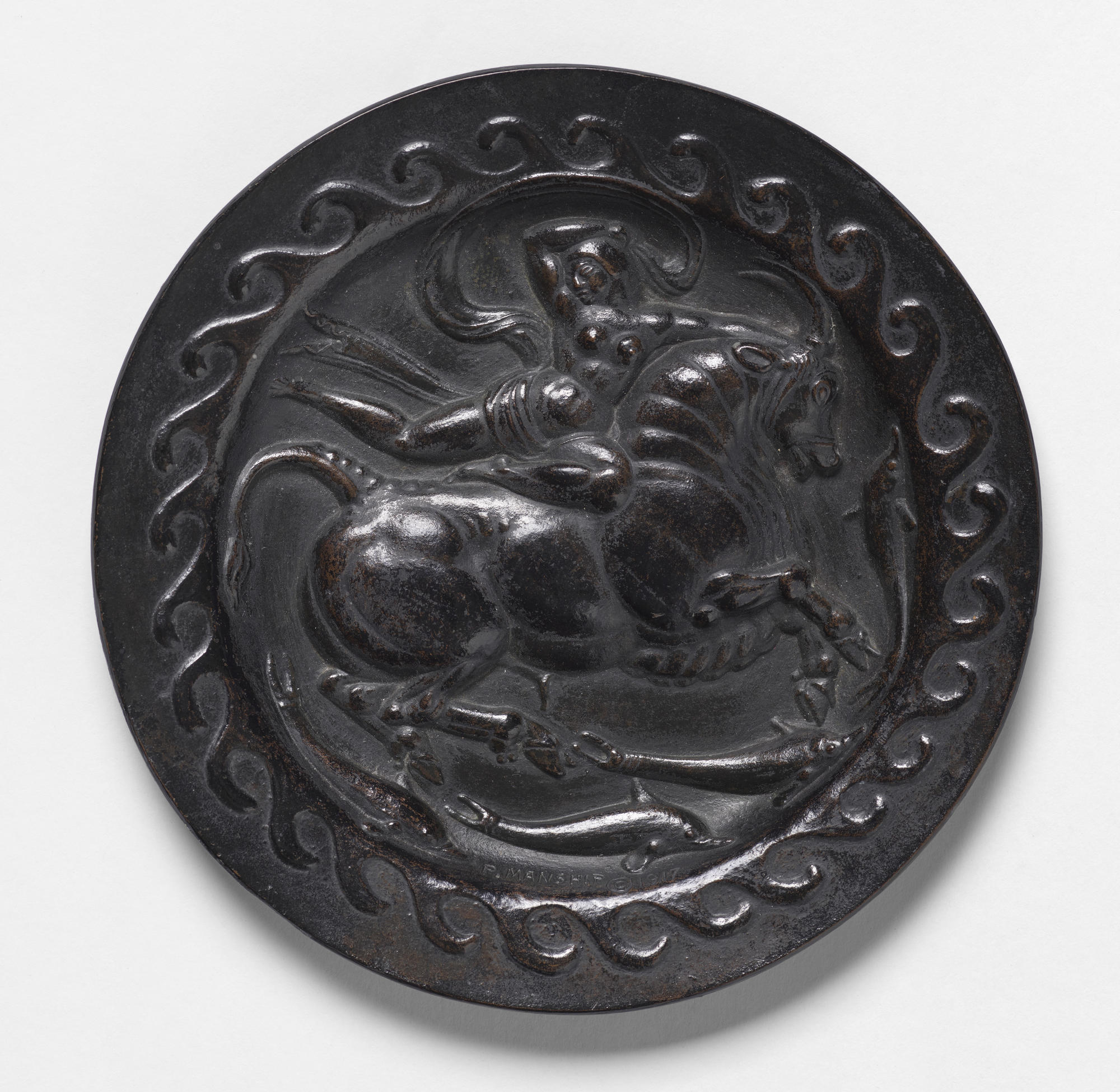 A circular bronze relief portraying Europa on a horse.