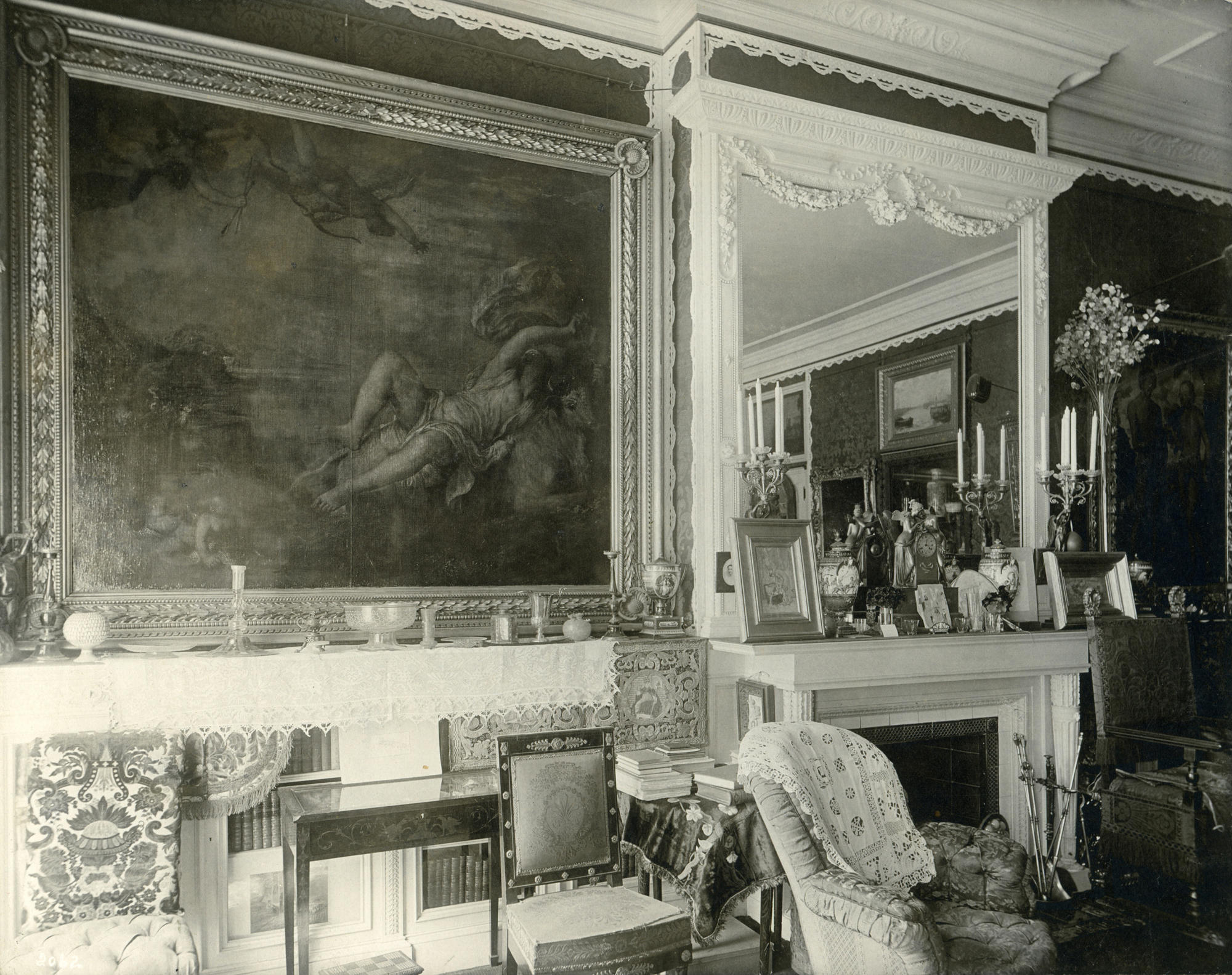 A black and white photo of Isabella Stewart Gardner's personal residence with Titian's Rape of Europa on the wall. 