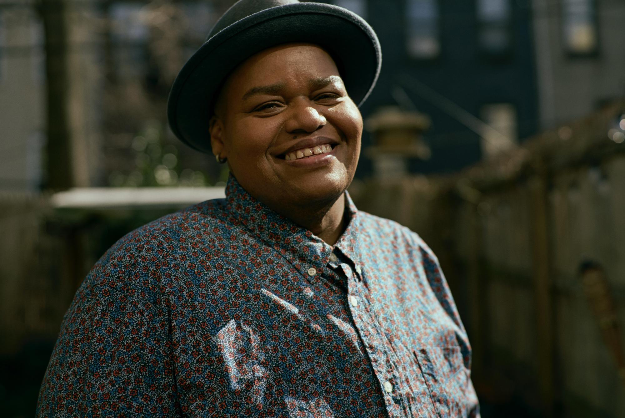 Toshi Reagon smiling outdoors.