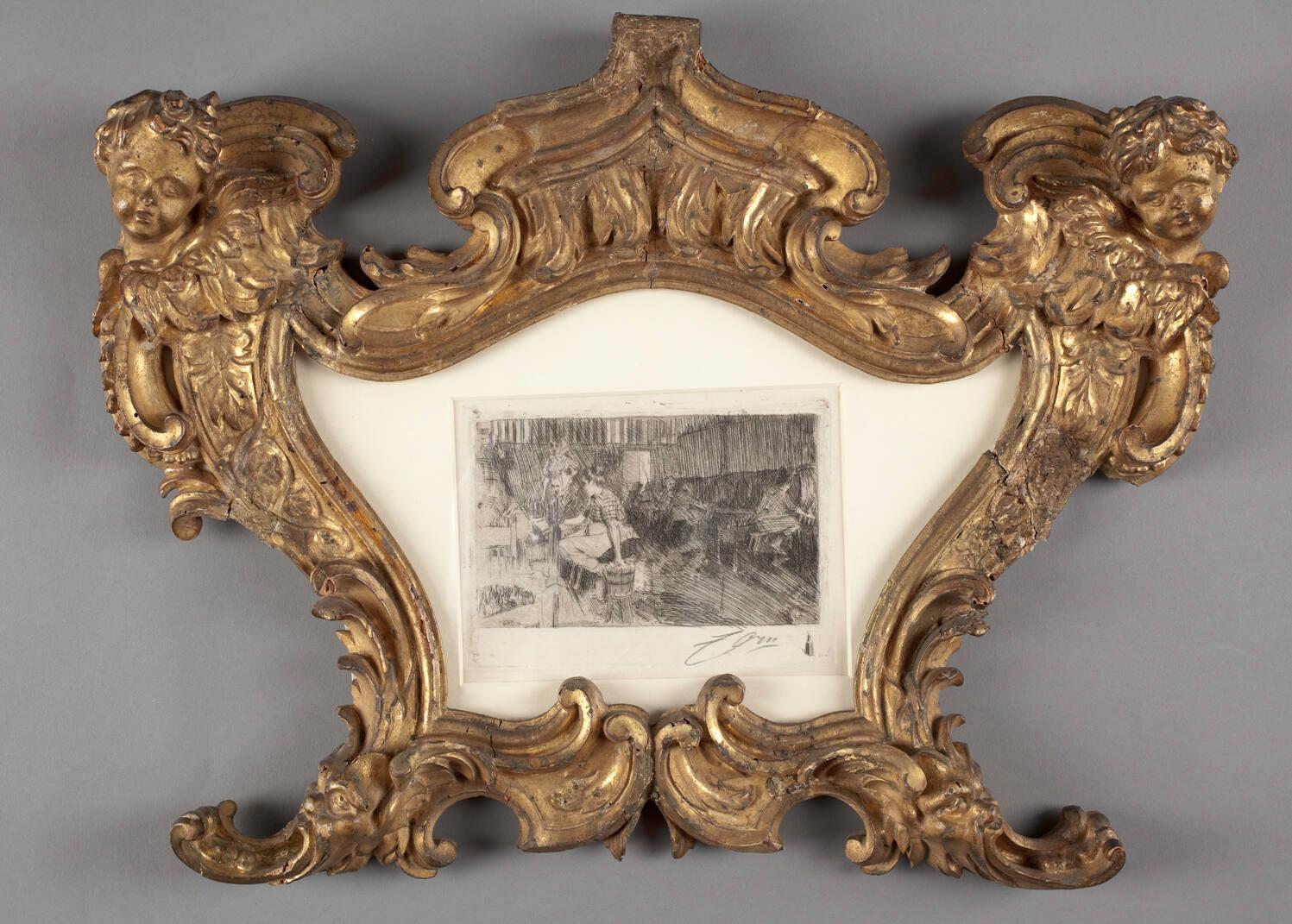 An ornate etching in a gold frame.