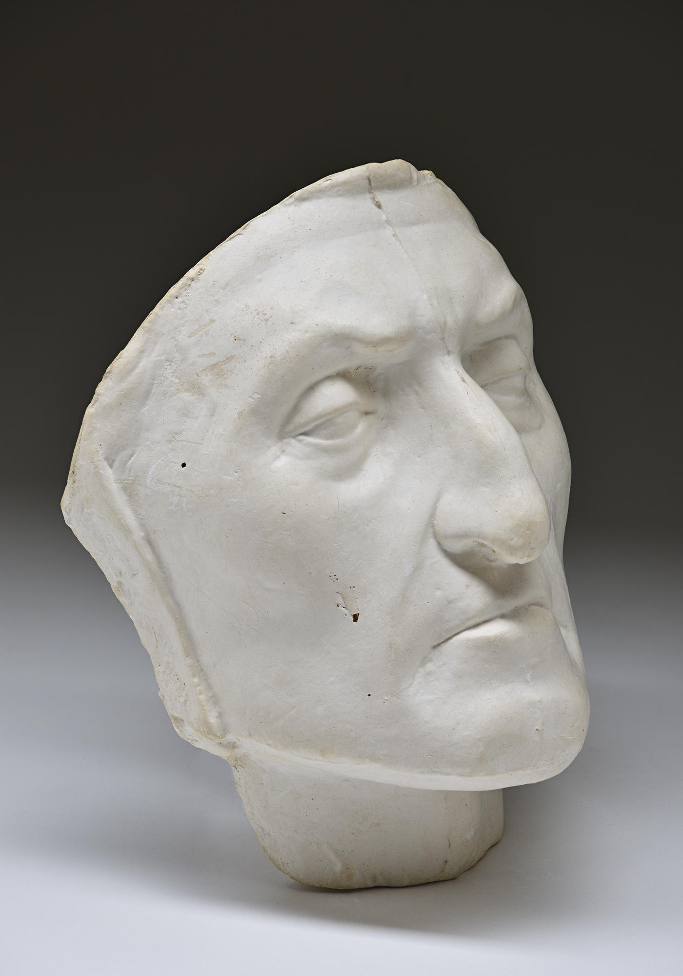 A white bust of a man. 