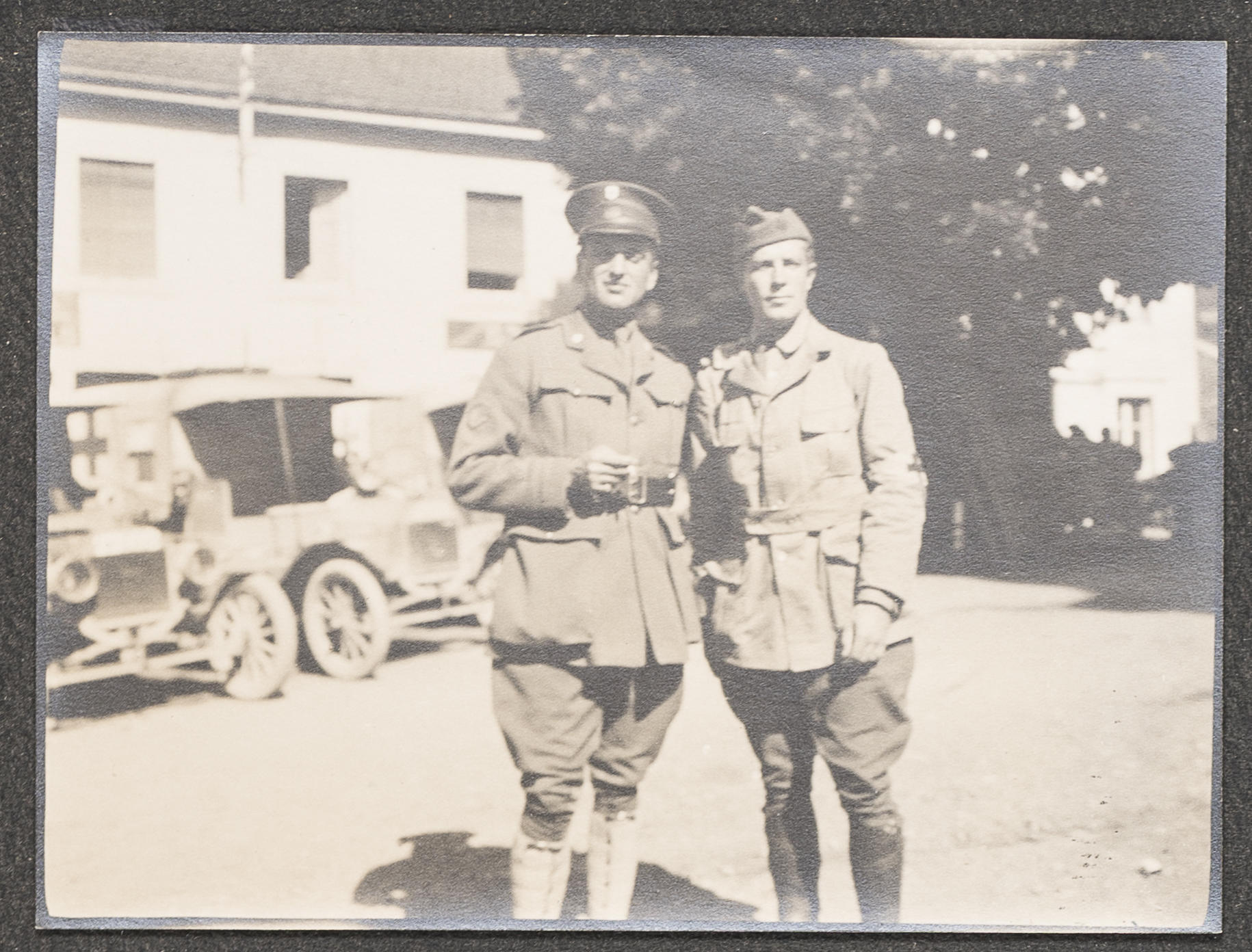Two men in uniform in France during WWI.