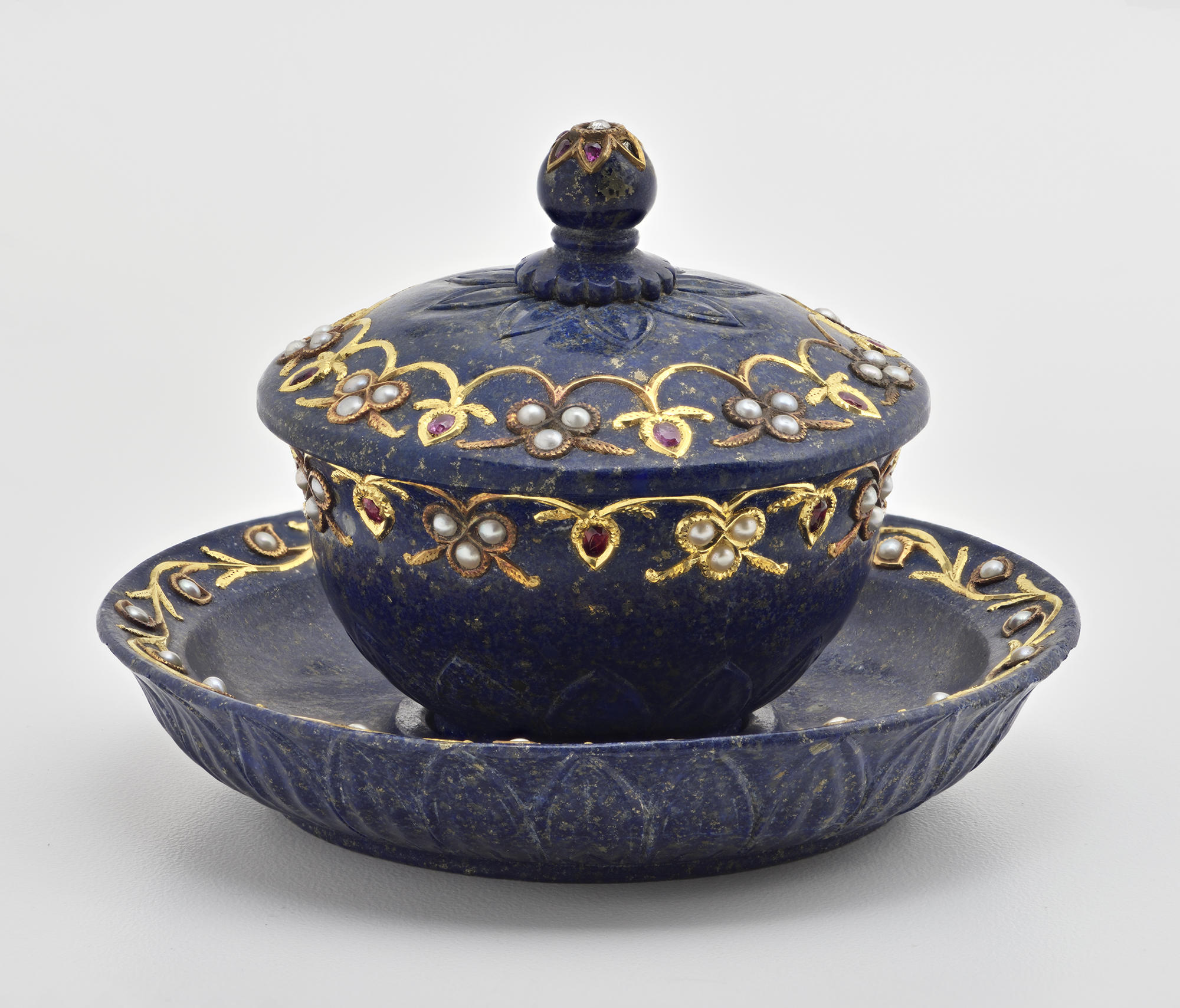 A blue teacup and matching saucer.