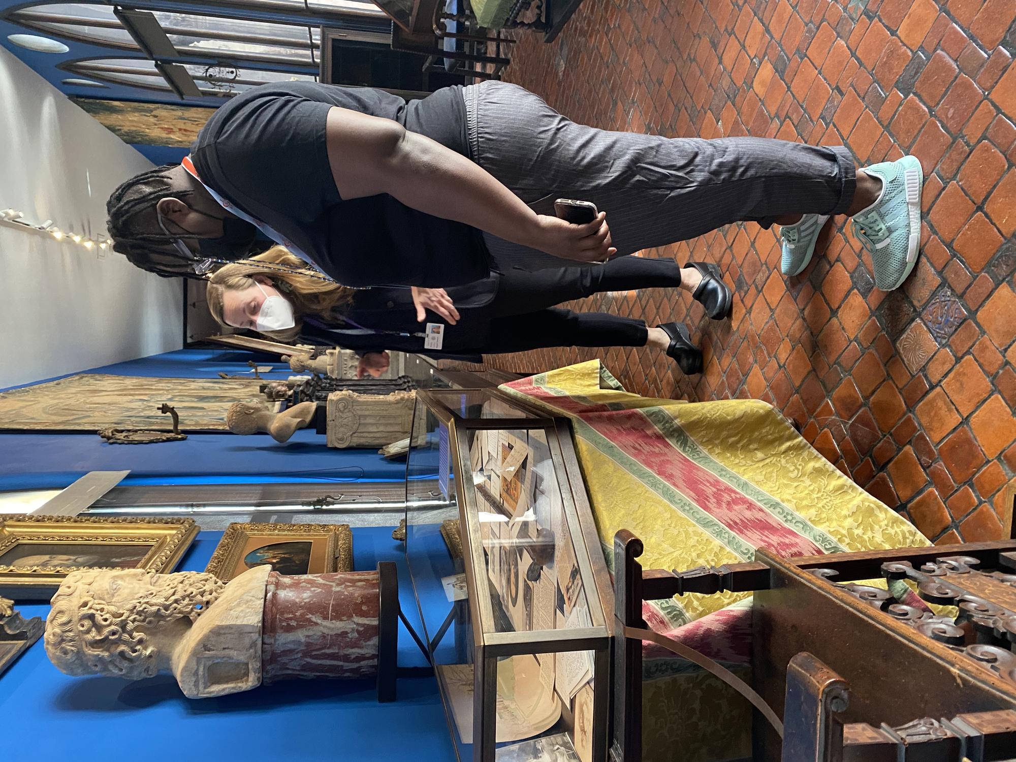 Porsha Olayiwola looks at letters in a glass case within the Blue Room at the Isabella Stuart Gardner Museum. 