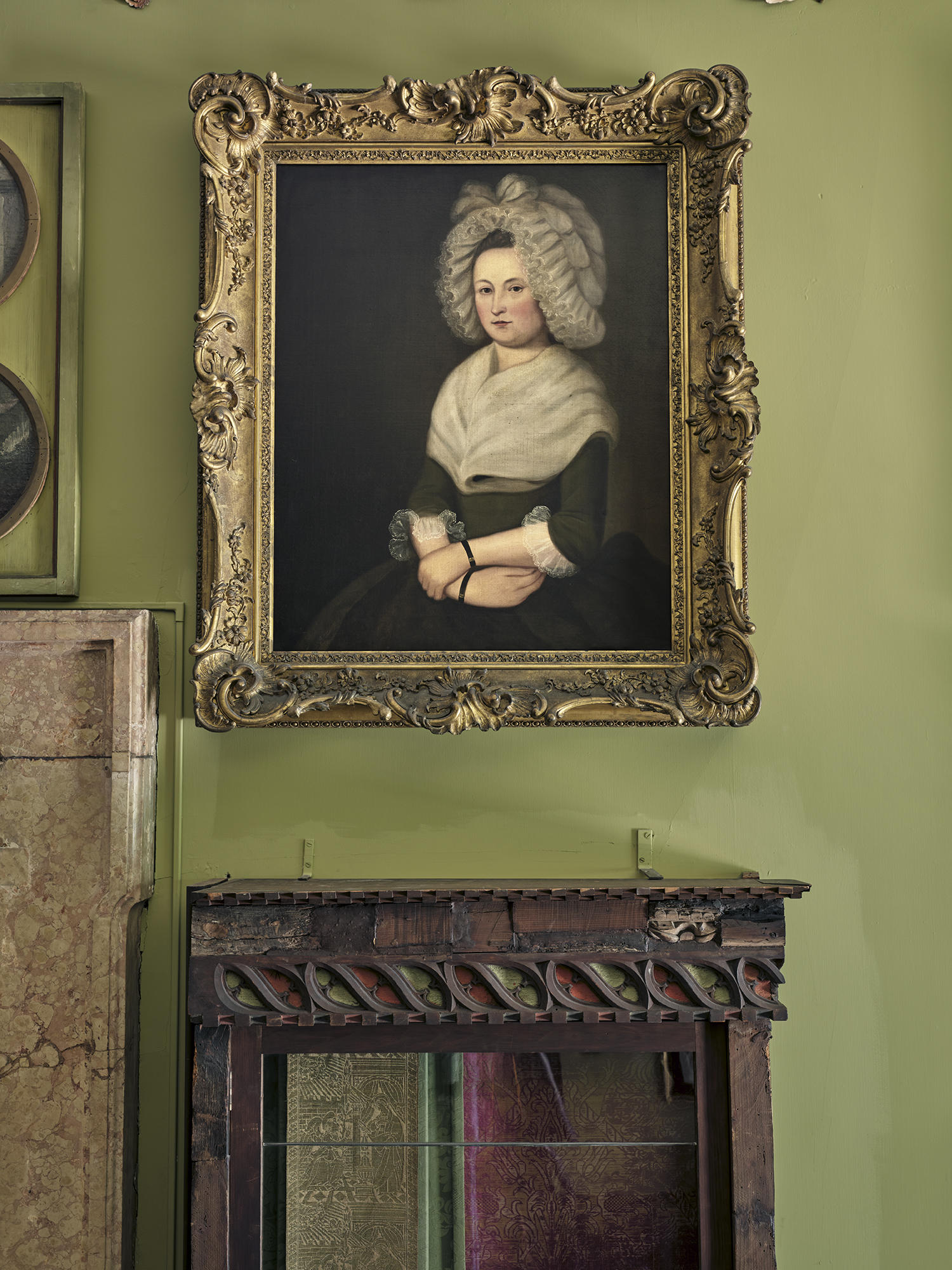 A portrait of Mary Burough Stewart above a table.