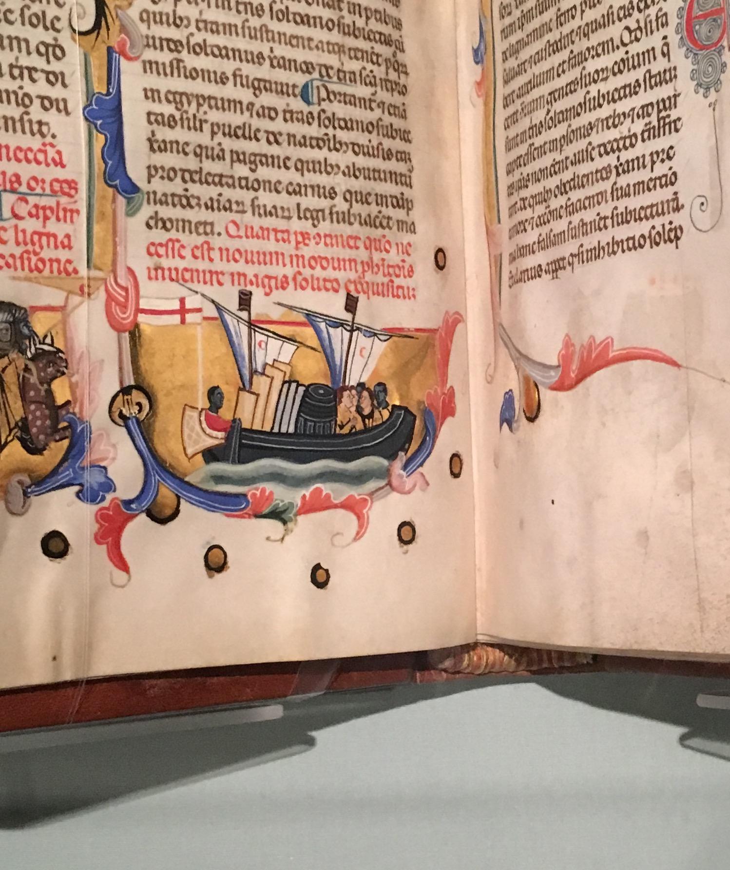 A close up of a hand drawn ship in an old book.