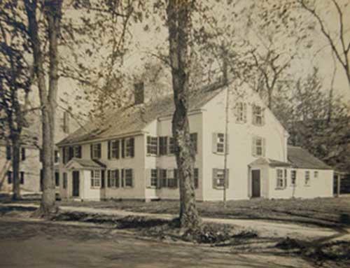 A photo of a large white house.