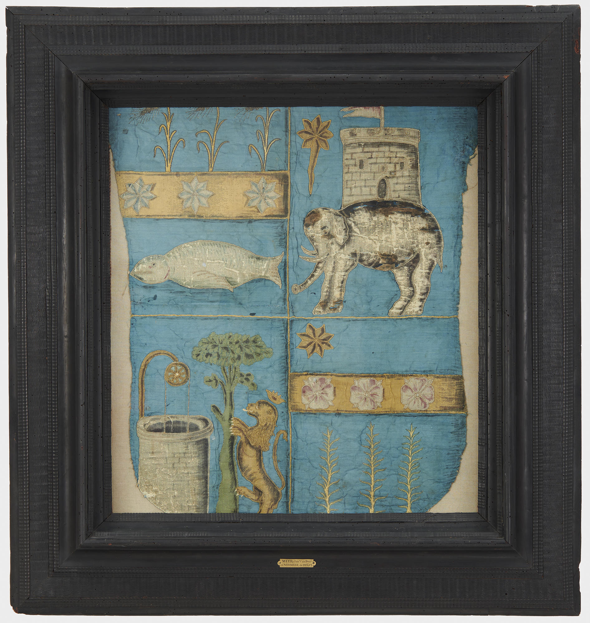 A framed piece of blue textile.