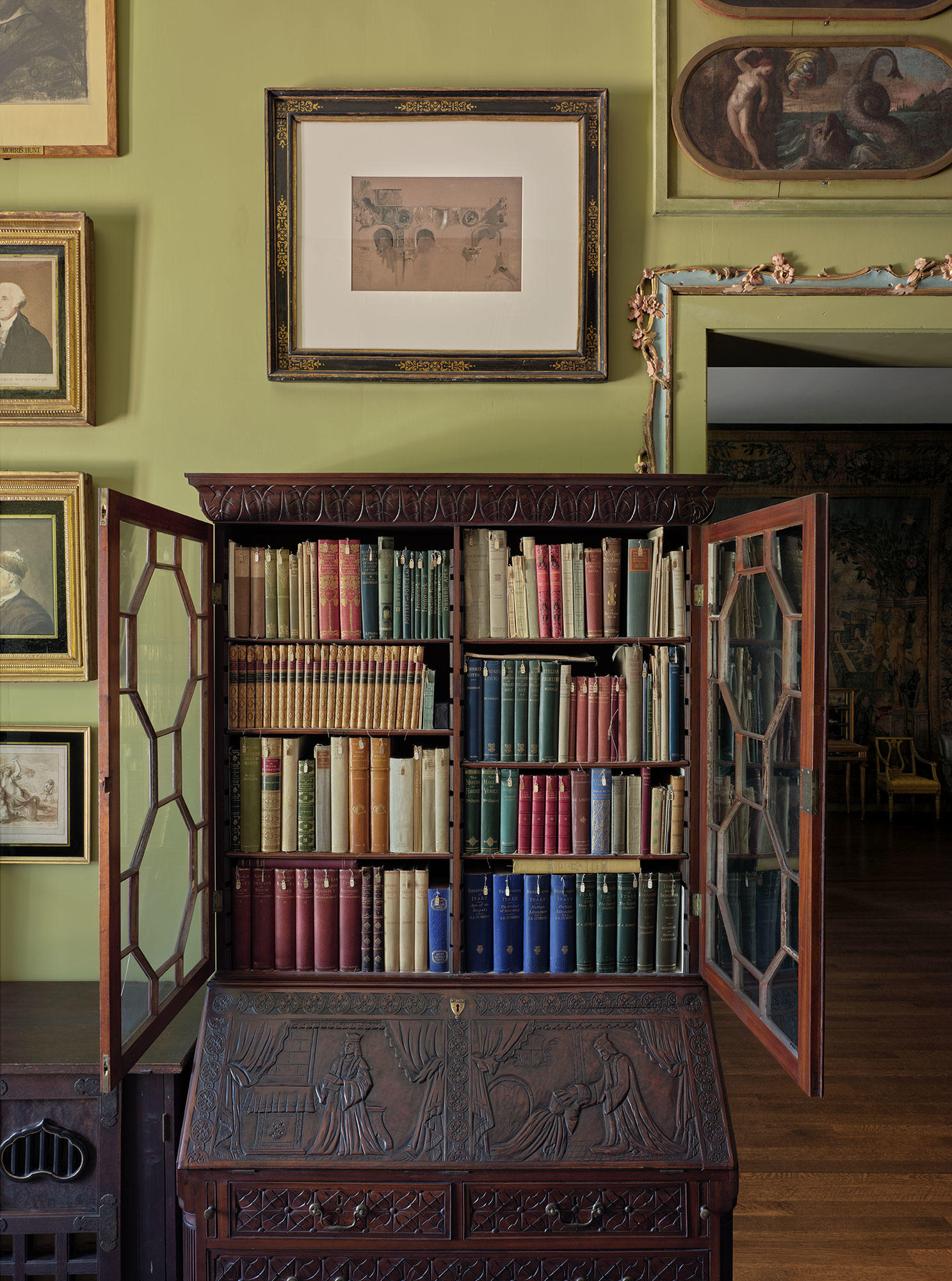 Bookcase in the Short Gallery containing artist biographies