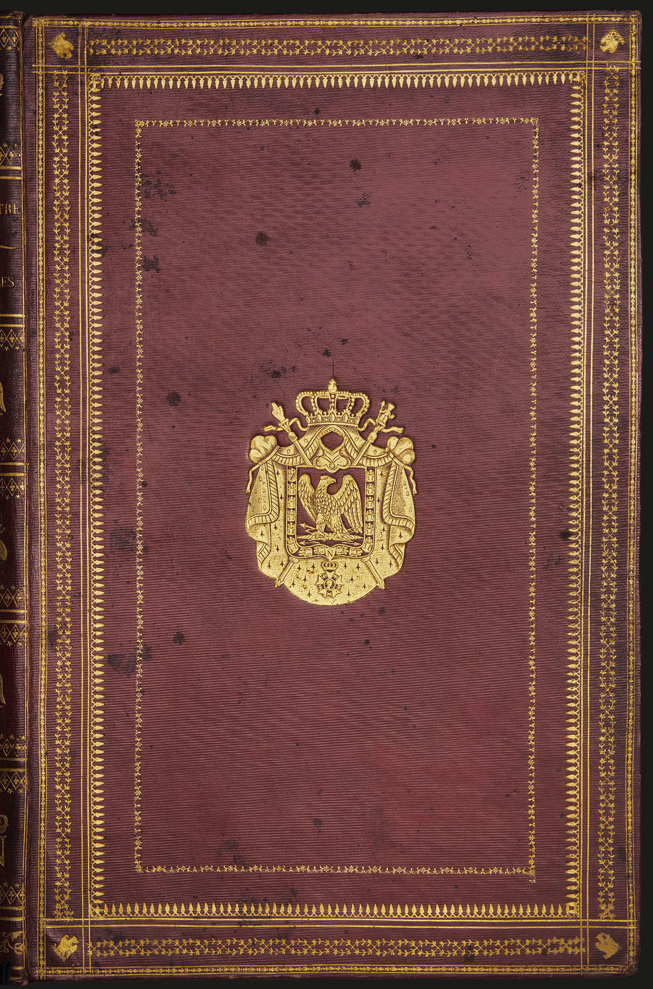 Front cover of large leather-bound book by Albert-Joseph-Ulpein Hennet with Napoleonic gilded coat of arms at center.