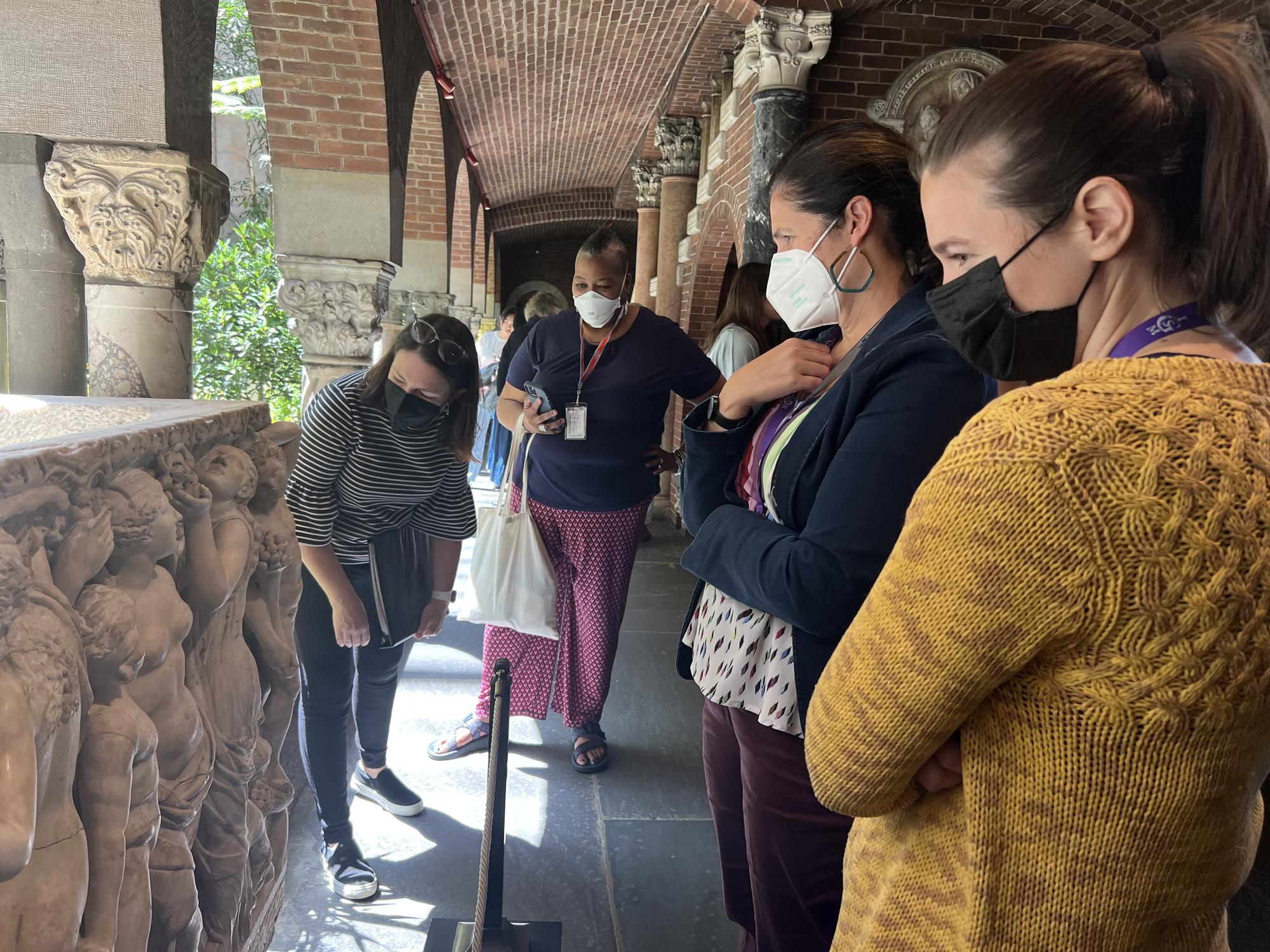 group photo of people in a courtyard