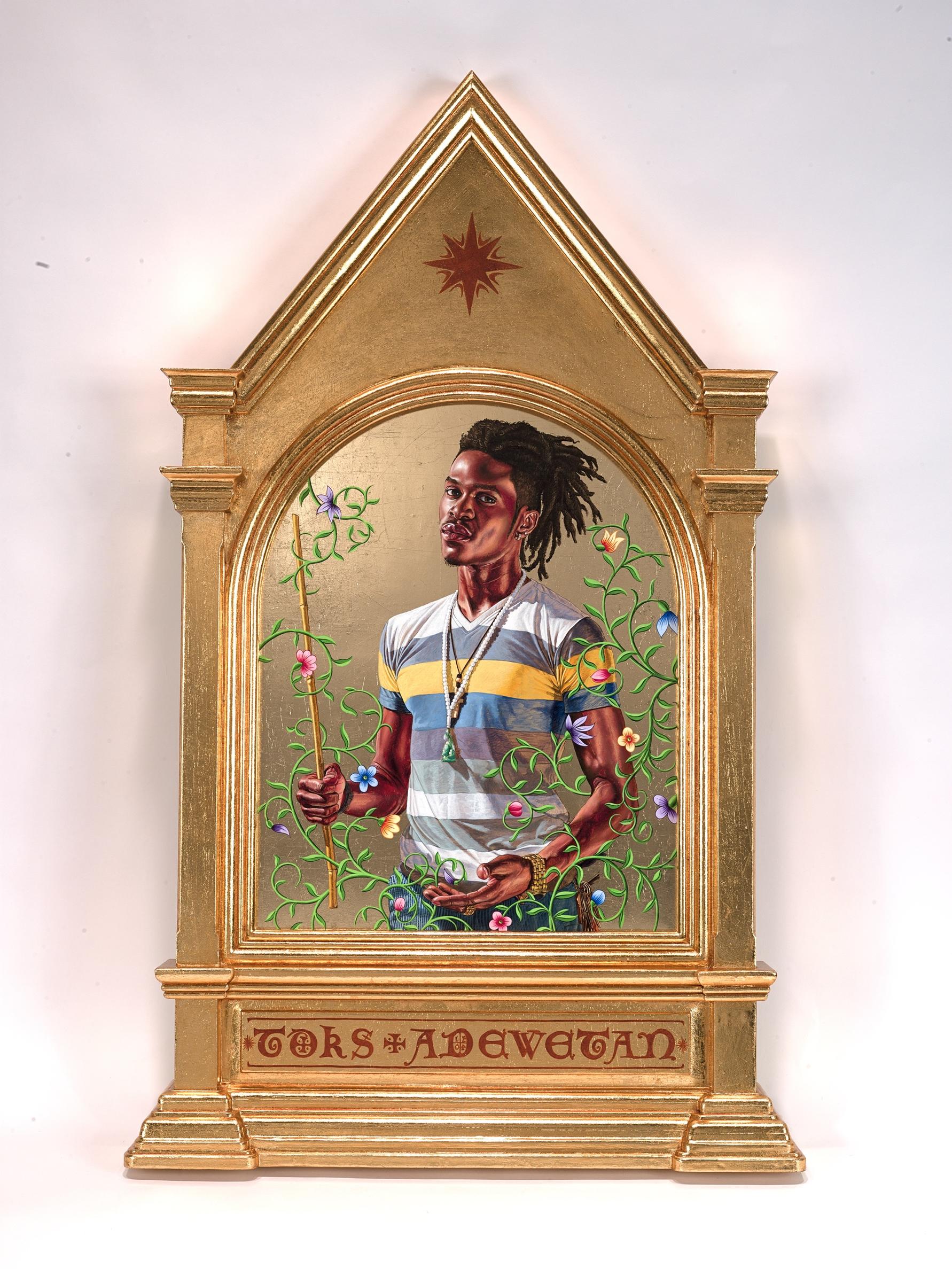 This oil and 22 karat gold leaf painting on wood panel measures approximately 40 x 24 inches. At the center is an image of a Black young man’s torso and head painted in vivid colors against a plain shiny gold background. This man has a muscular and toned body and he stands facing the viewer, turned slightly toward our left. He has deep reddish brown skin and his dark dreadlocks flow behind him. He looks confidently at the viewer with a direct gaze. He is dressed in a short-sleeved t-shirt that has white, gr