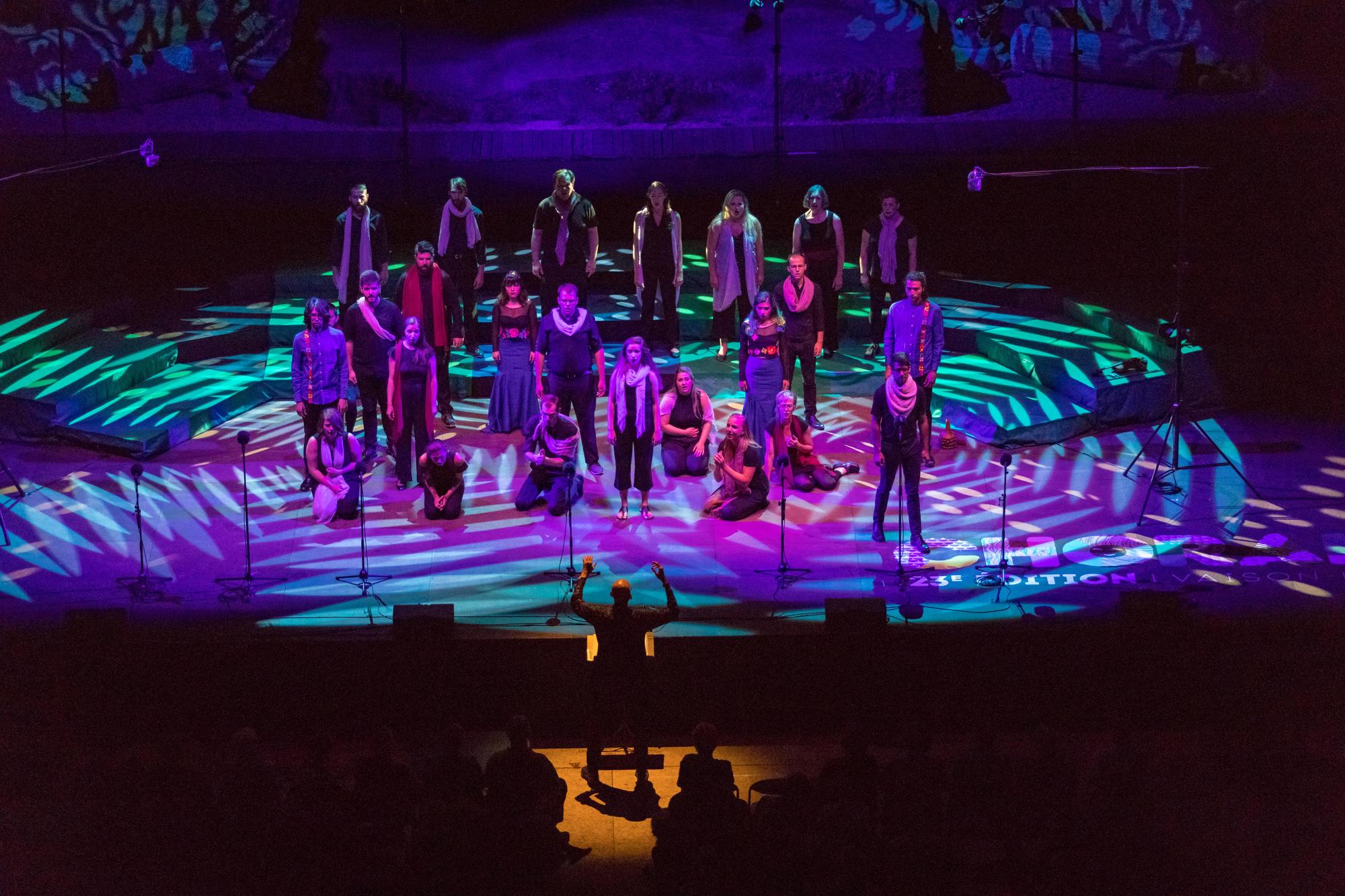 Photo of musicians on a stage with their instruments.