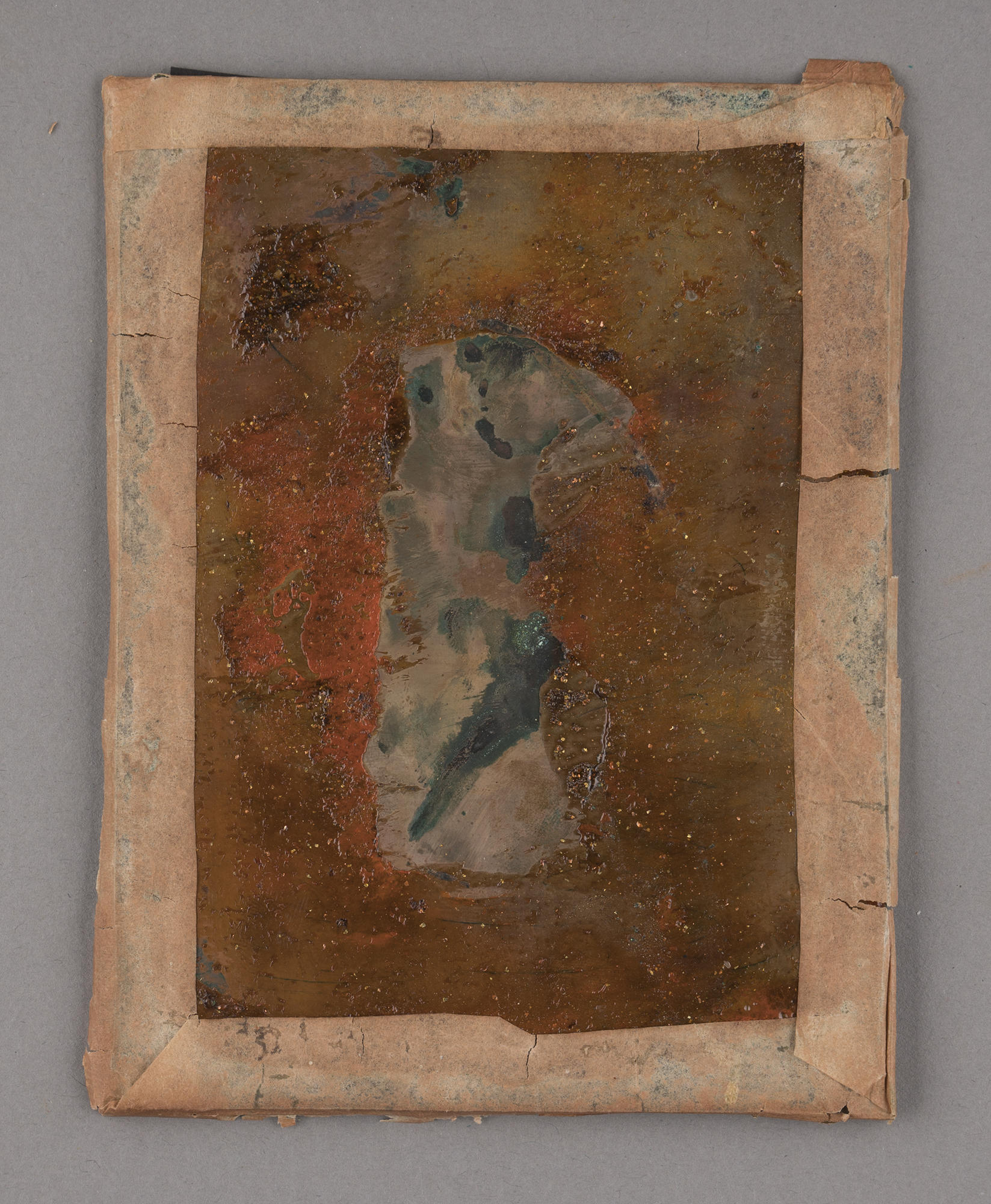 The back of the rectangular daguerreotype of Julia Gardner with tape around the edges.