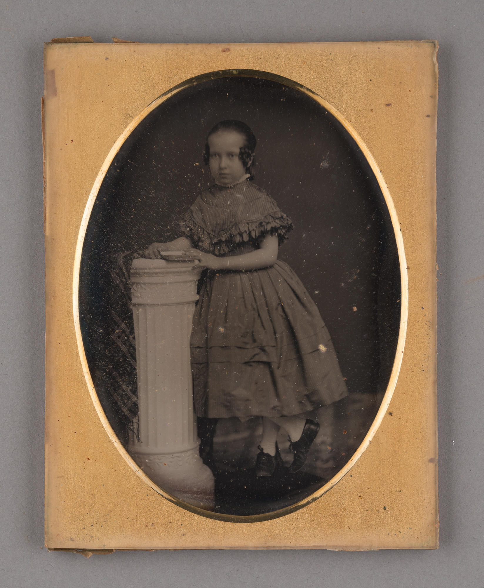 The front of the daguerreotype of Julia Gardner with an oval mat.