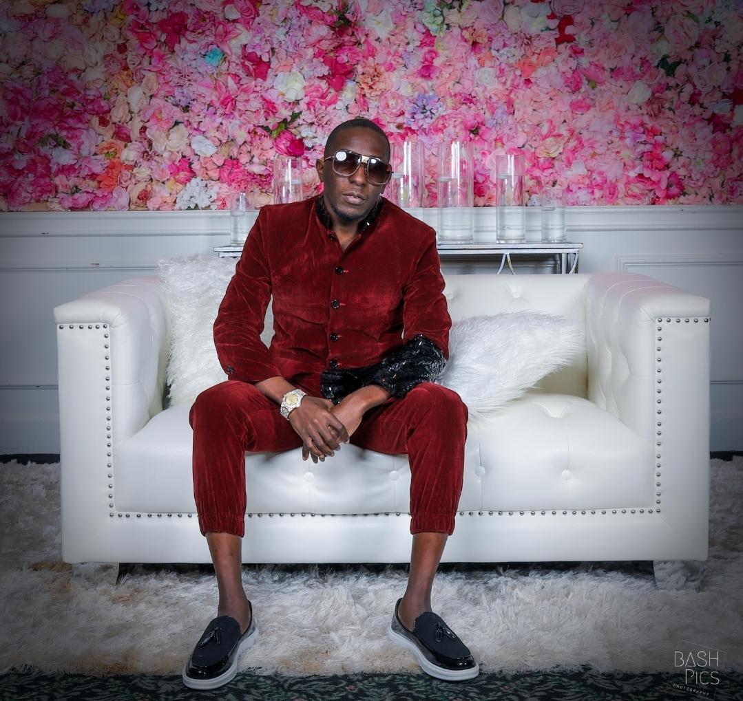 Photo of a person in a red suit.