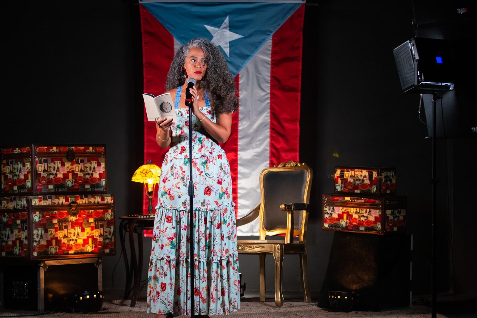 Photo of a woman on a stage. 