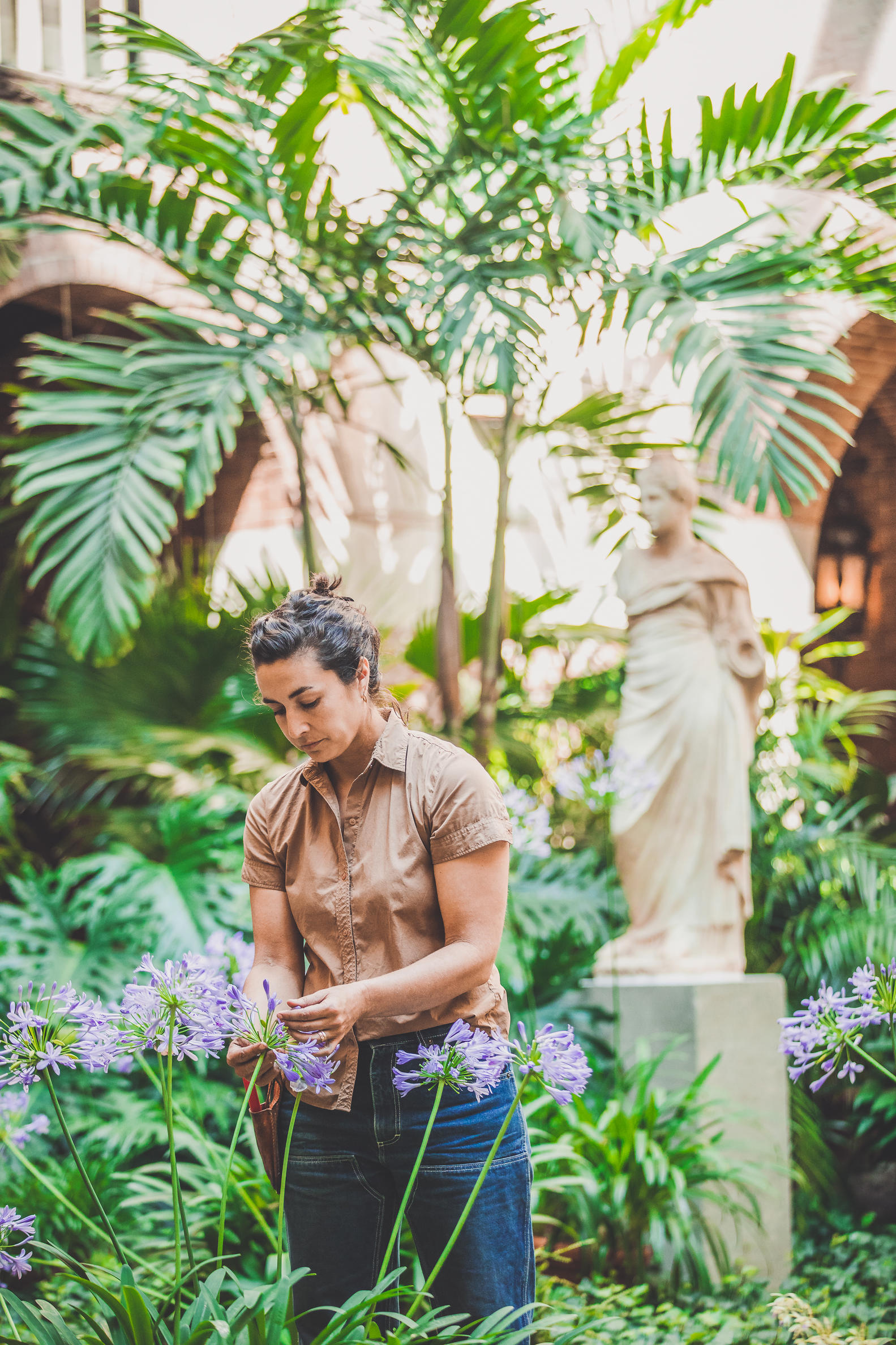 Photo of person working with plants.