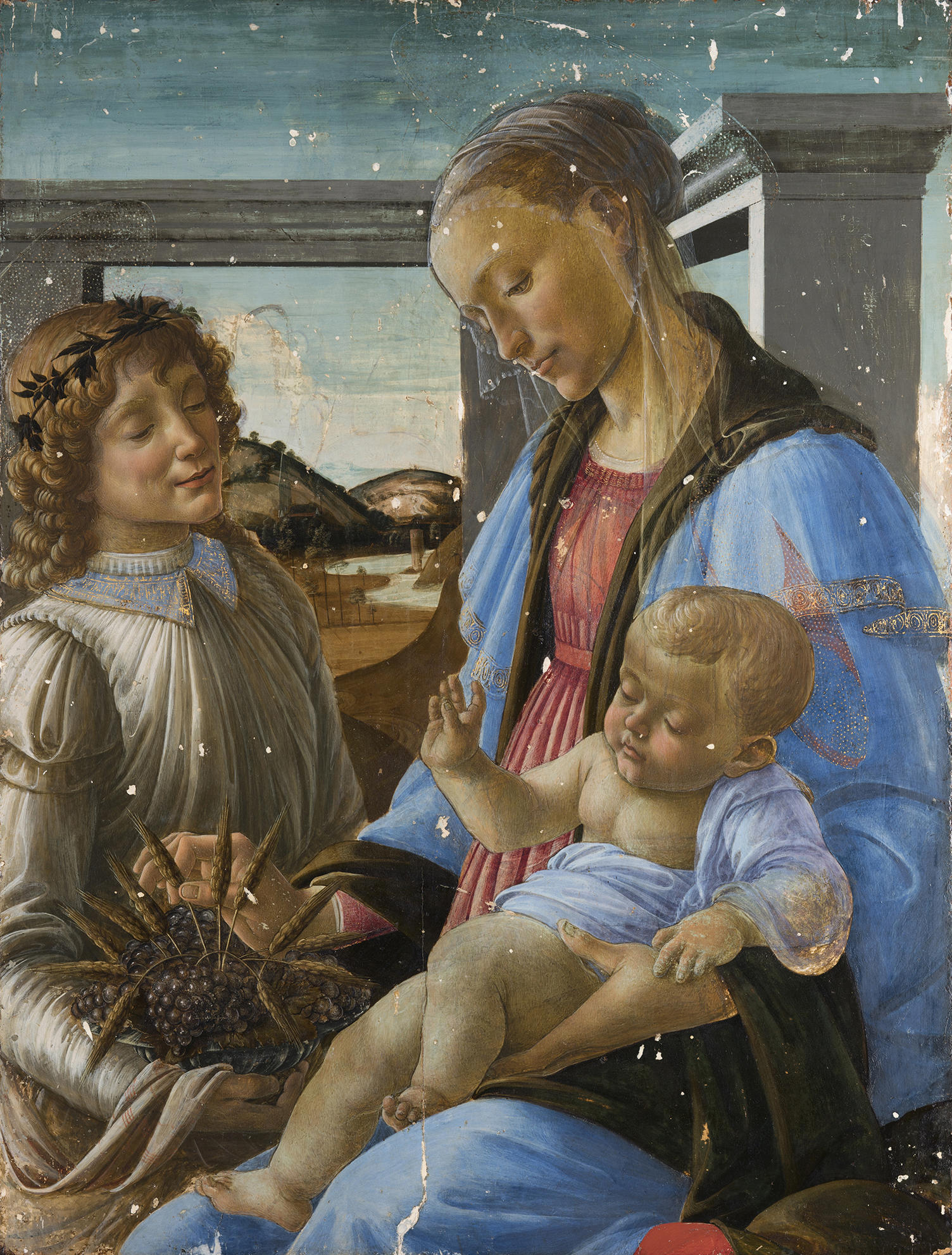 Botticelli’s painting Virgin and Child with an Angel with white spots where old varnish and restorations have been removed