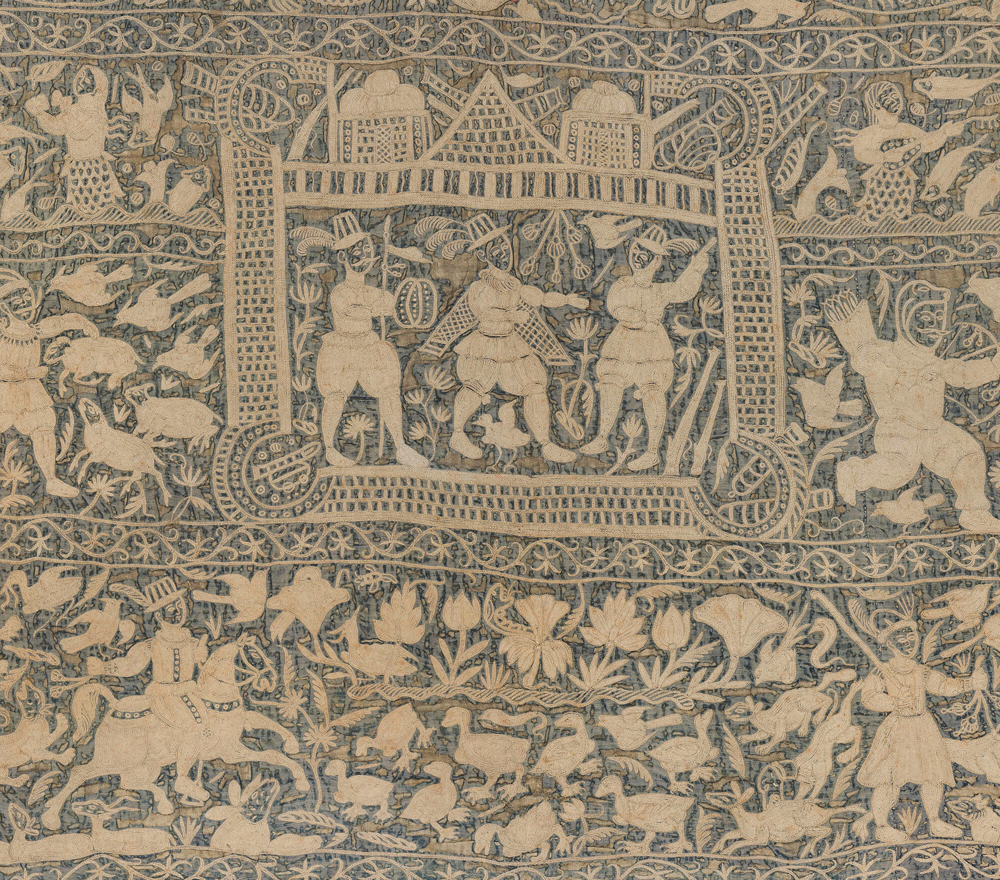 A detail of an embroidered wall hanging in the Gardner Museum of cream colored thread on a dark blue background. Three men in 17th century European dress are surrounded by a wall. On the outside of the wall are sheep, ducks, and vegetation.