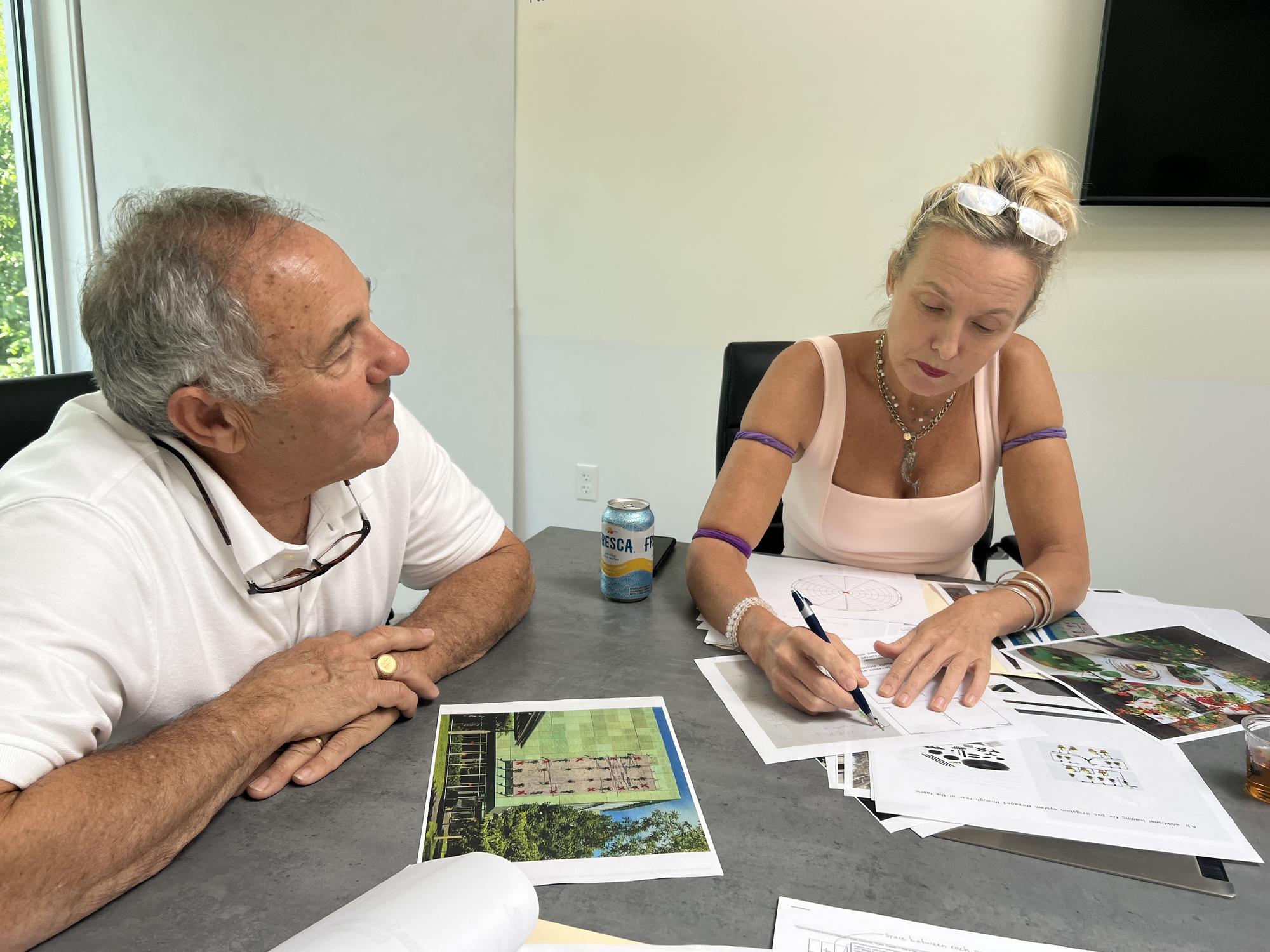 Natalie Jeremijenko and Joe Correia discuss design options for the Façade panels at the Boston Building Wraps office, 2022.