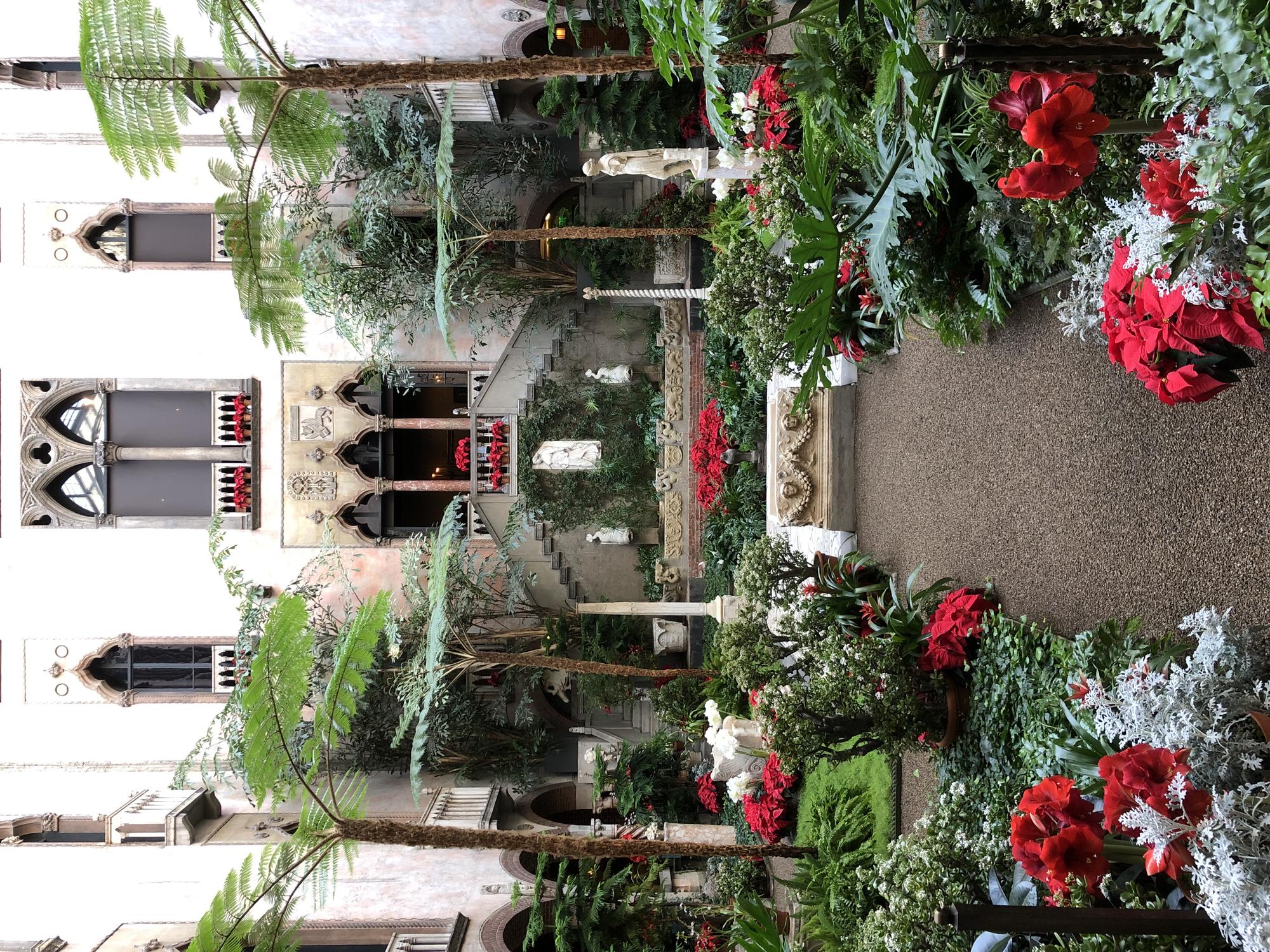 Flowering jade plants anchor the corners in the Courtyard of the Gardner Museum.