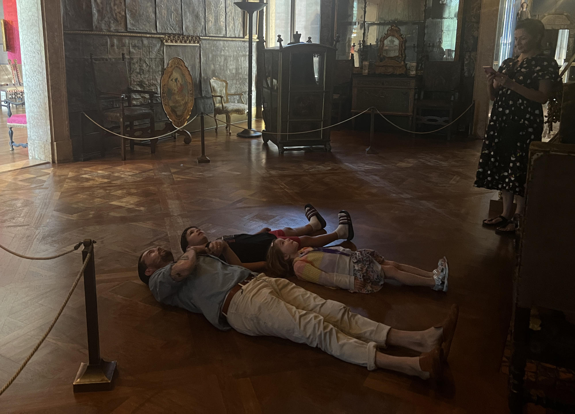 Oliver Jeffers and his family enjoying Paolo Veronese’s "Coronation of Hebe", a large painting that Isabella Stewart Gardner installed on the ceiling of the Veronese Room.