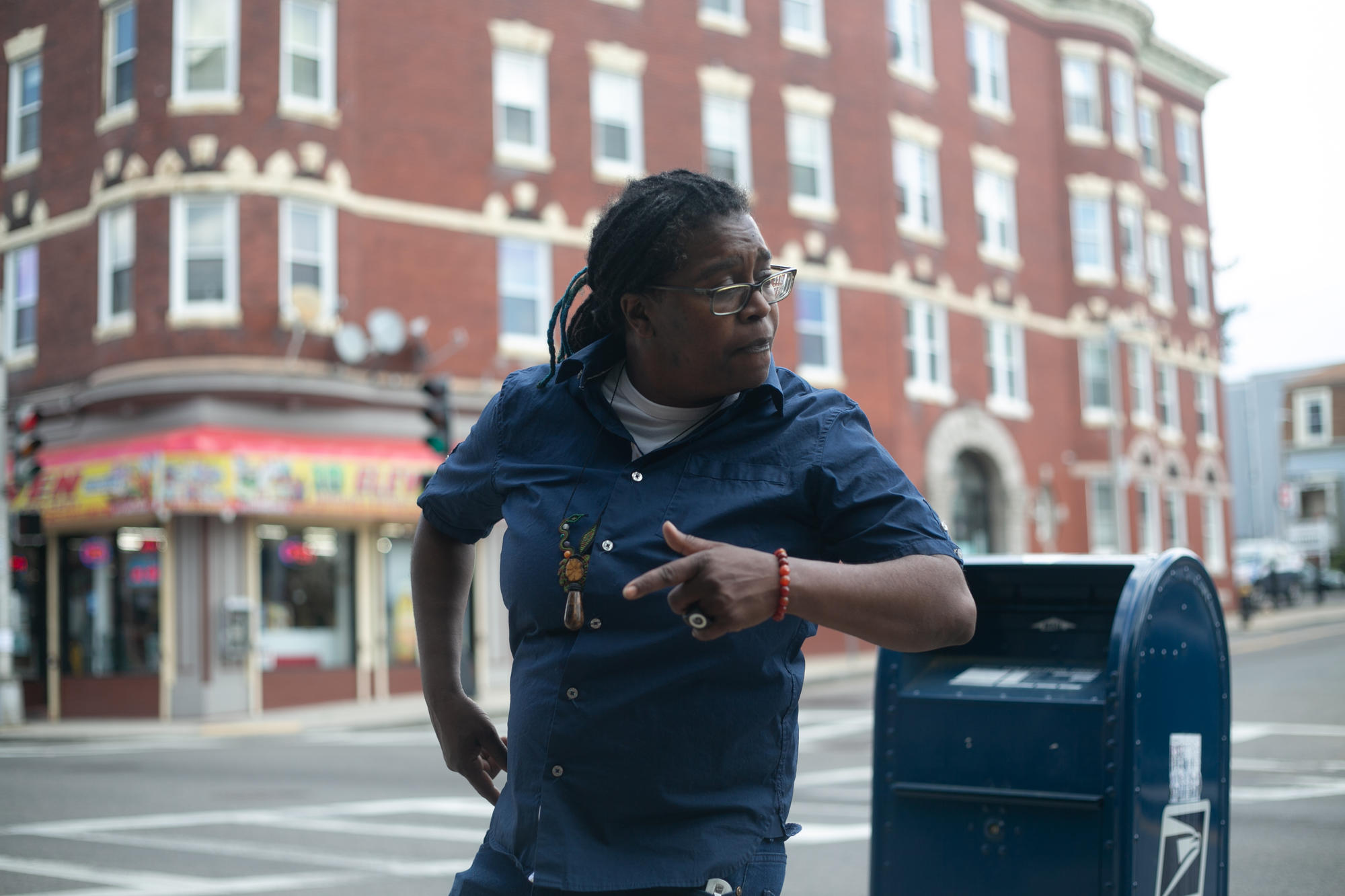 Letta Neely leaning against a mailbox