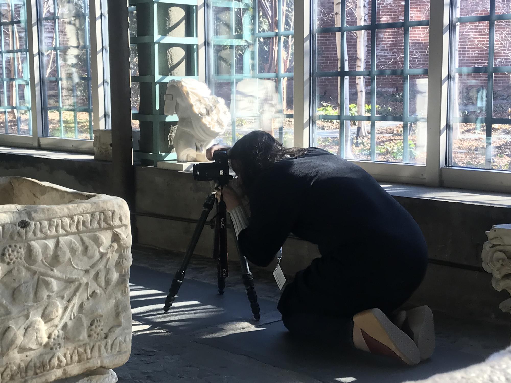 Nicole Cherubini photographing objects in the Chinese Loggia, 2019