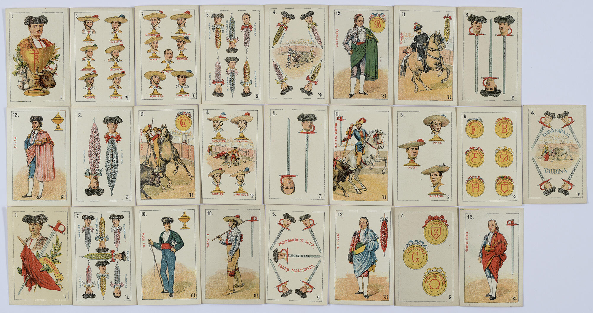  An overhead view of 25 playing cards from the same deck, decorated with various scenes of bullfighting and matadors.