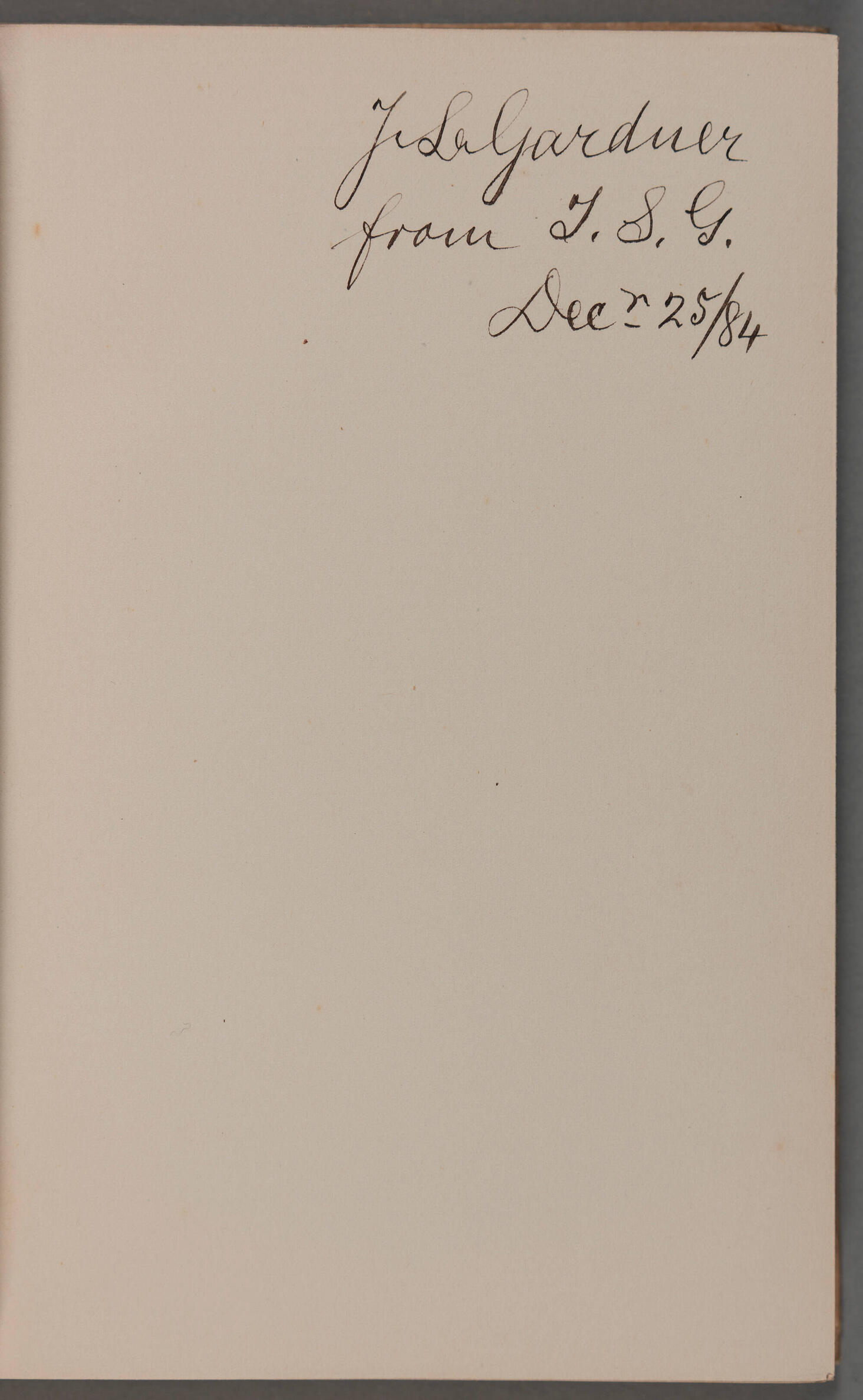  A book page inscribed in black ink J. L. Gardner / from I.S.G. Decr 25/ 84