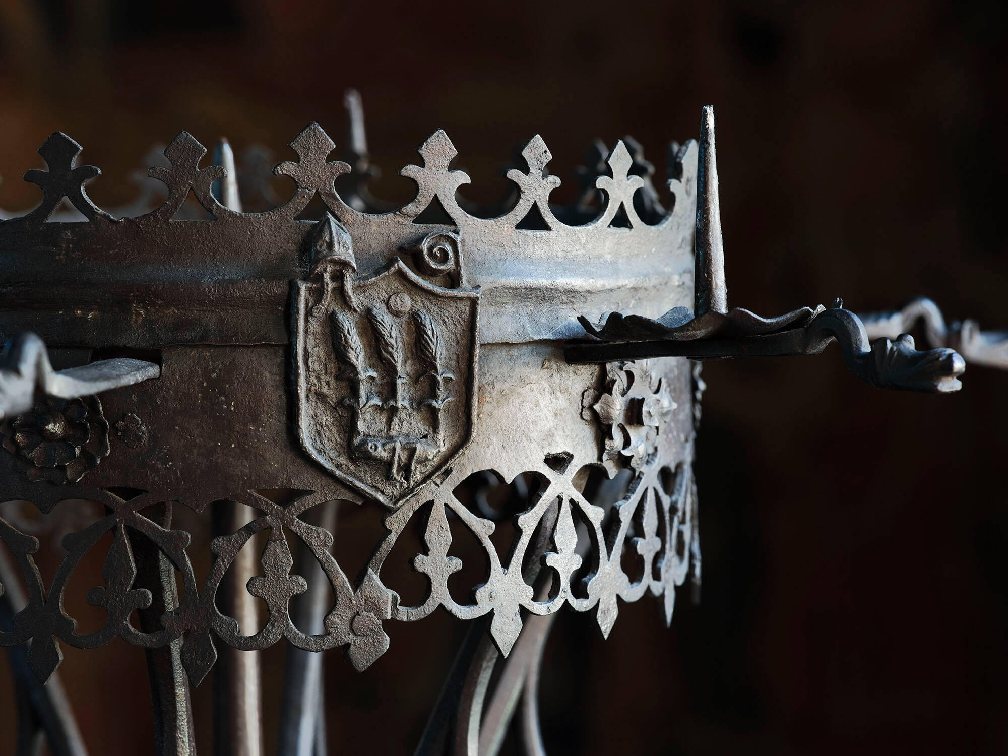  A detail of the candelabra showing a shield with a grasshopper and three ears of wheat