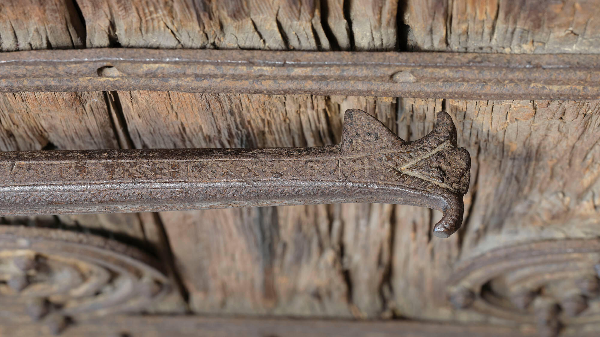 Detail of the iron drawbar on the door.