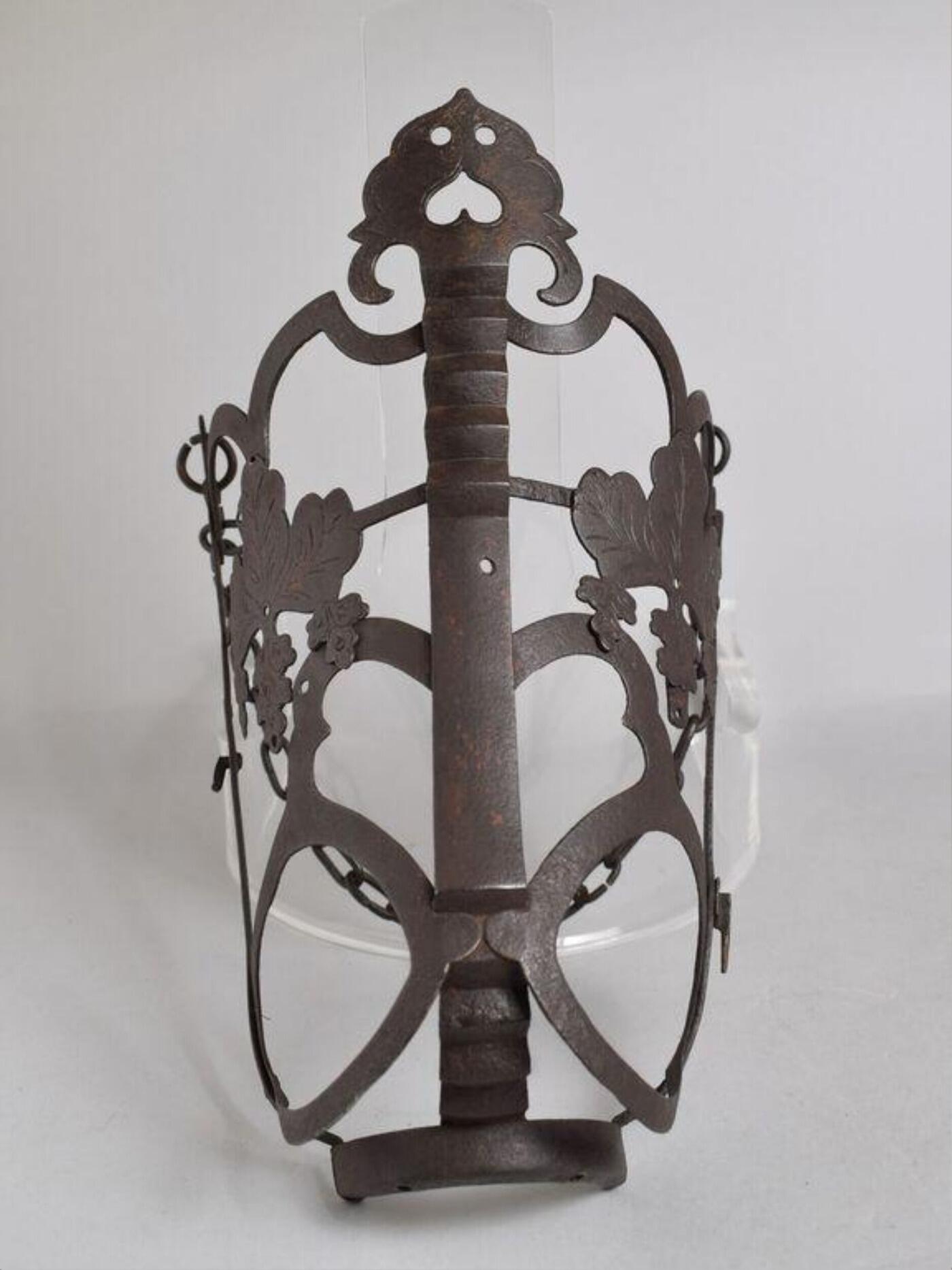 An elaborately decorated metal horse muzzle.