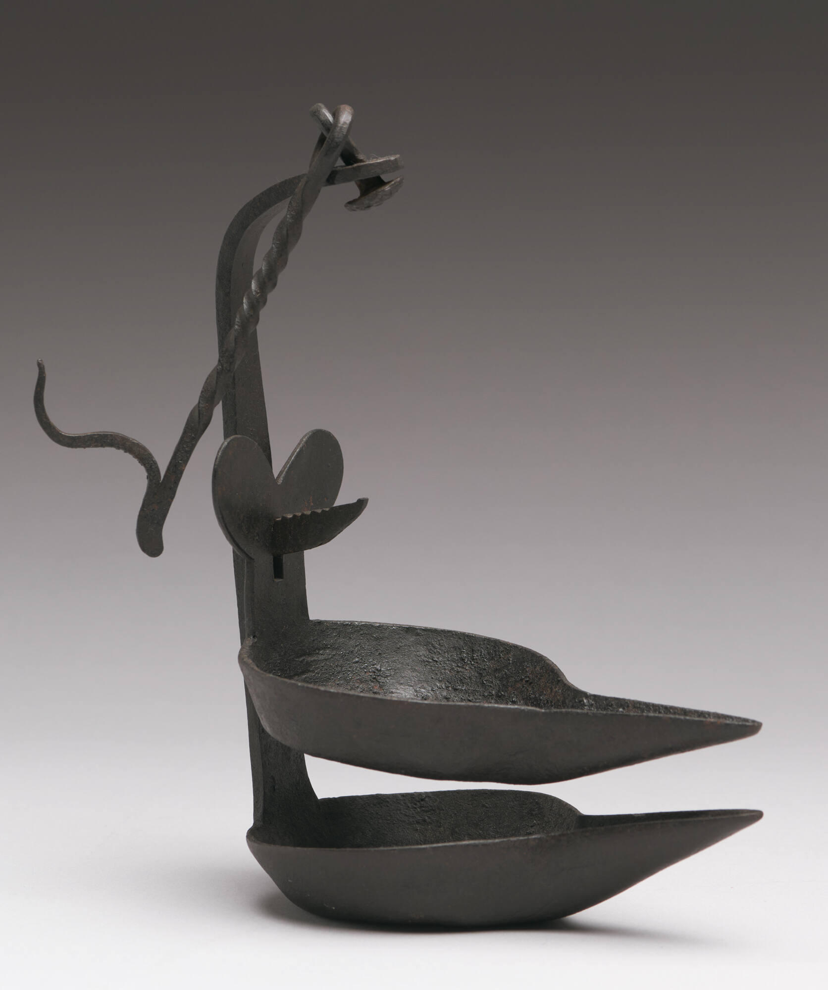 Two iron spouted containers with a handle and a hook.