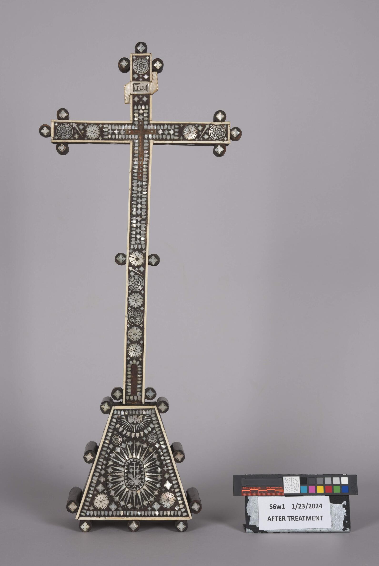 Before treatment photography of the object, areas of loss on the mother-of-pearl and bone detailing can be seen. 