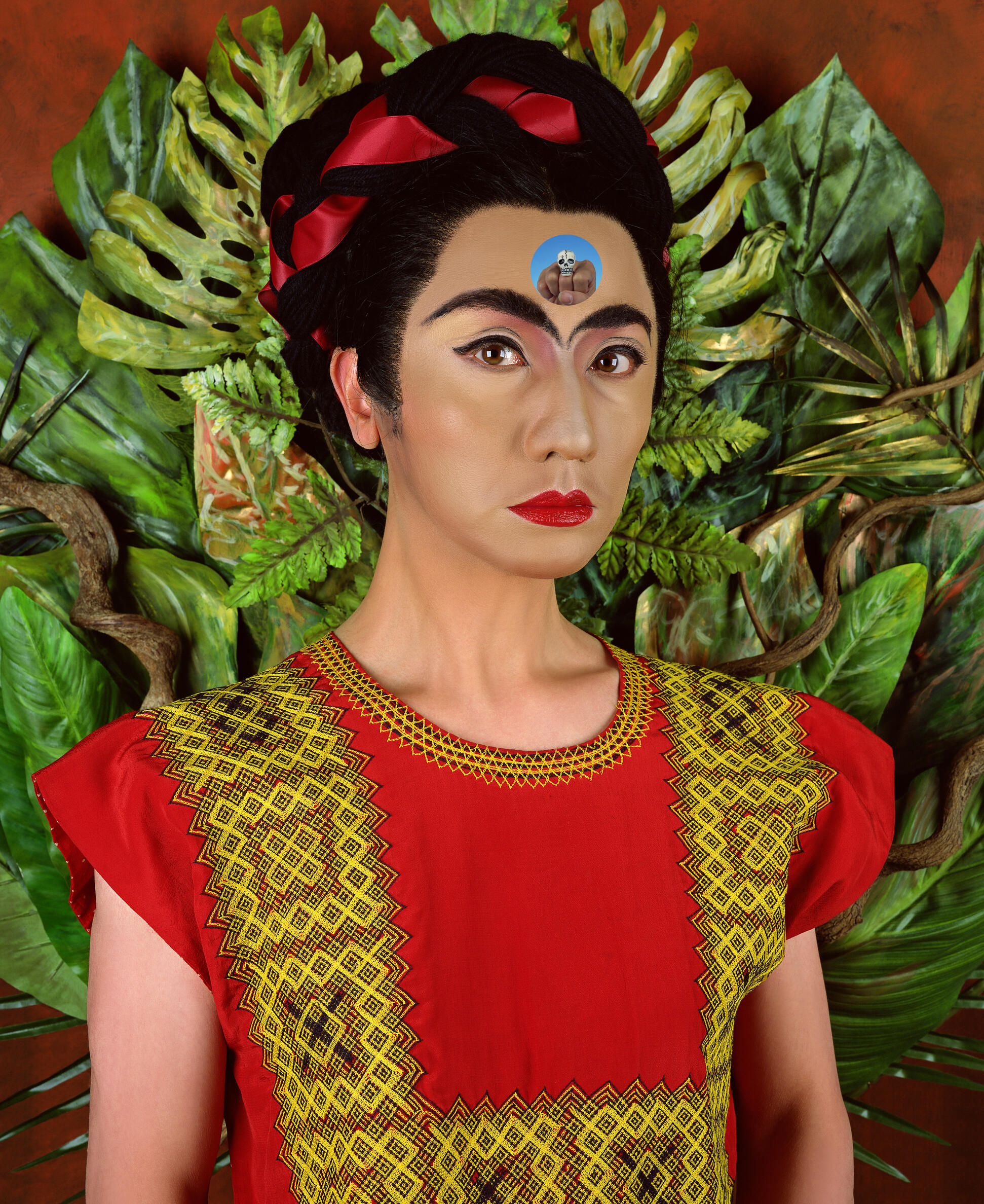 Painting of a woman resembling Frida Kahlo with dark hair piled on top of her head standing in front of lush green plants. 