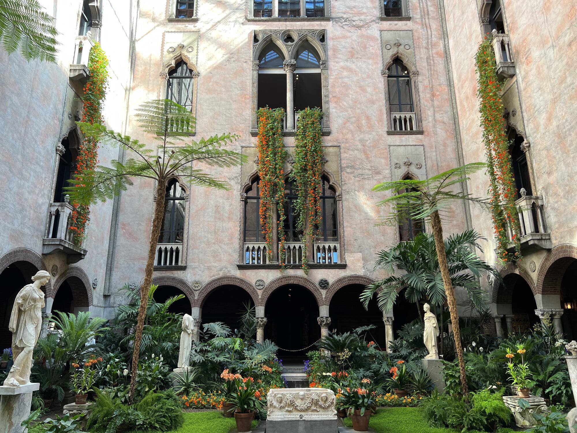 Cascades of orange nasturtiums hang from the third-floor balconies.