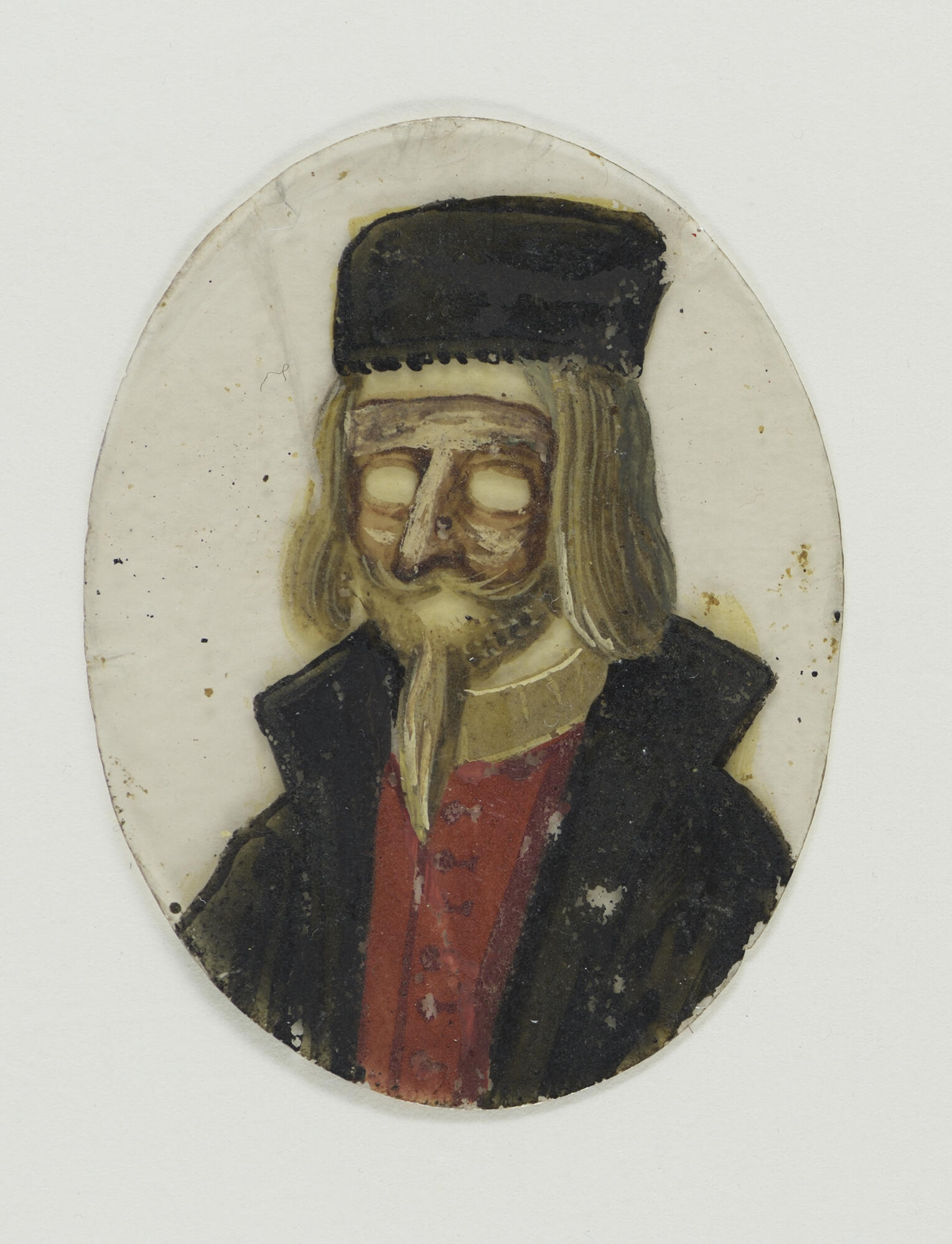 A transparent oval painted shoulder length hair, a beard, a mask, a black hat, jacket, and red shirt.